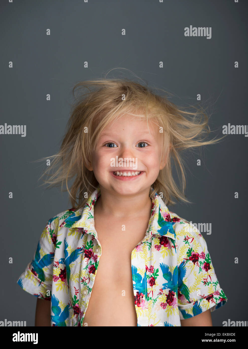 Portrait of young boy with messy hair, smiling Stock Photo