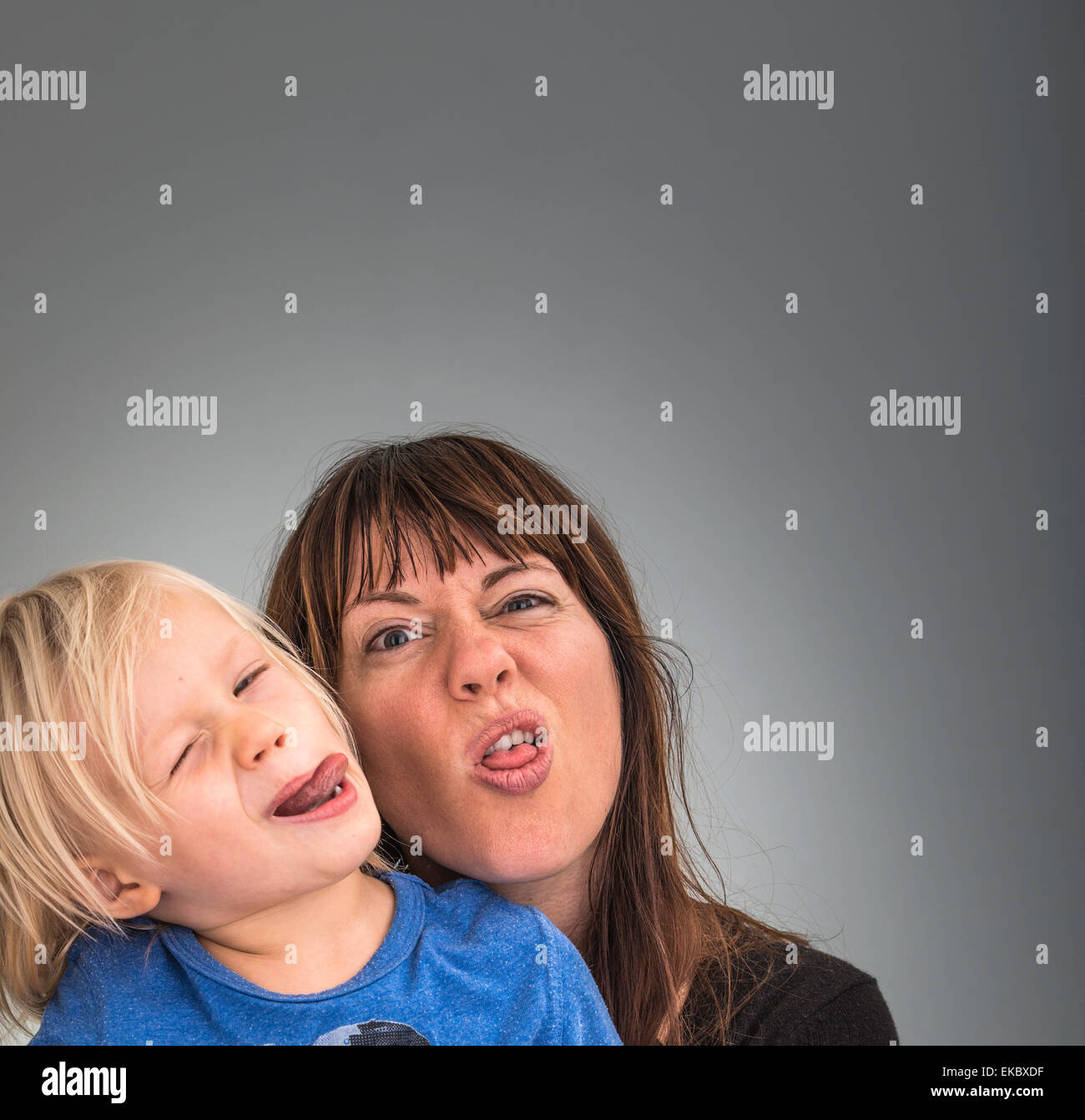 Portrait of mother and son, pulling faces Stock Photo