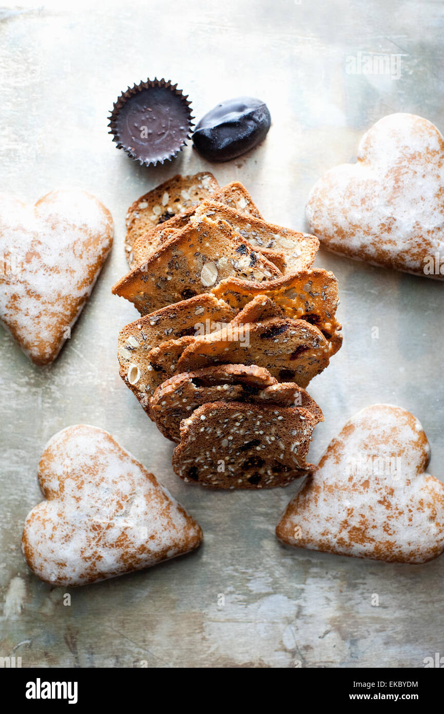 Heart-shaped gingerbread cookies, crackers, chocolate Stock Photo