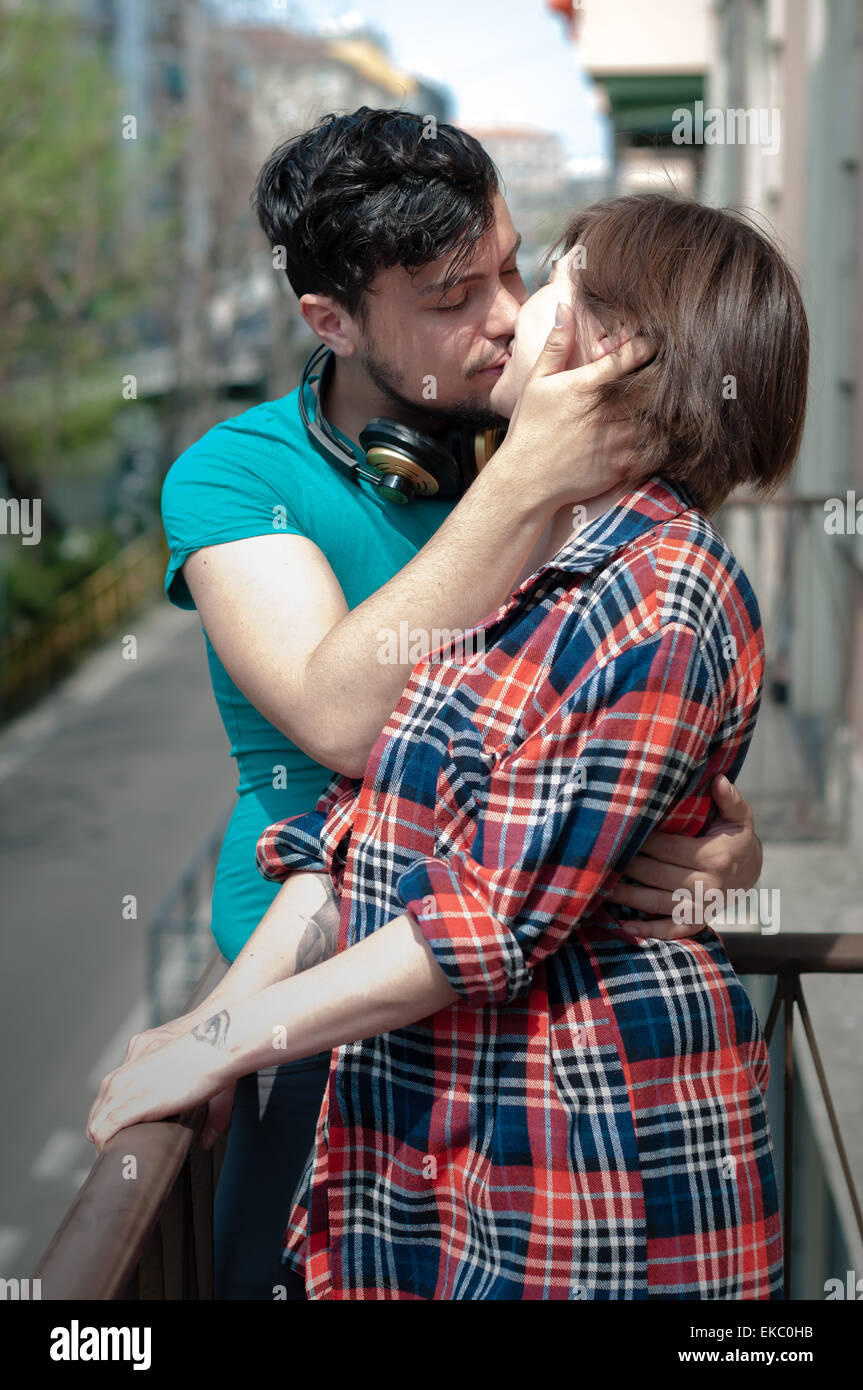 Young couple kissing in street hi-res stock photography and images - Alamy