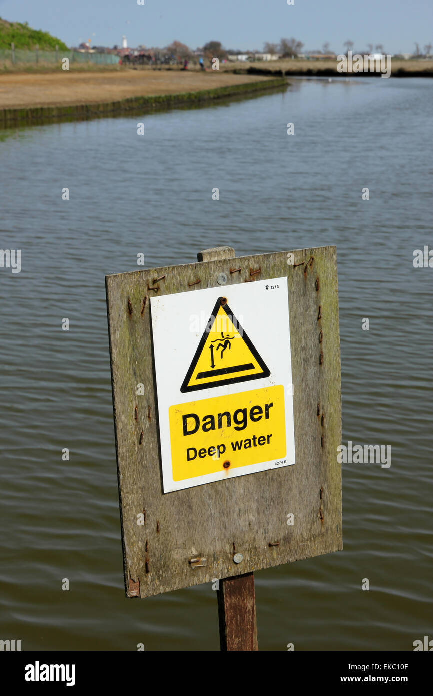 Danger deep water warning sign at crabbing site Walberswick Suffolk Stock Photo
