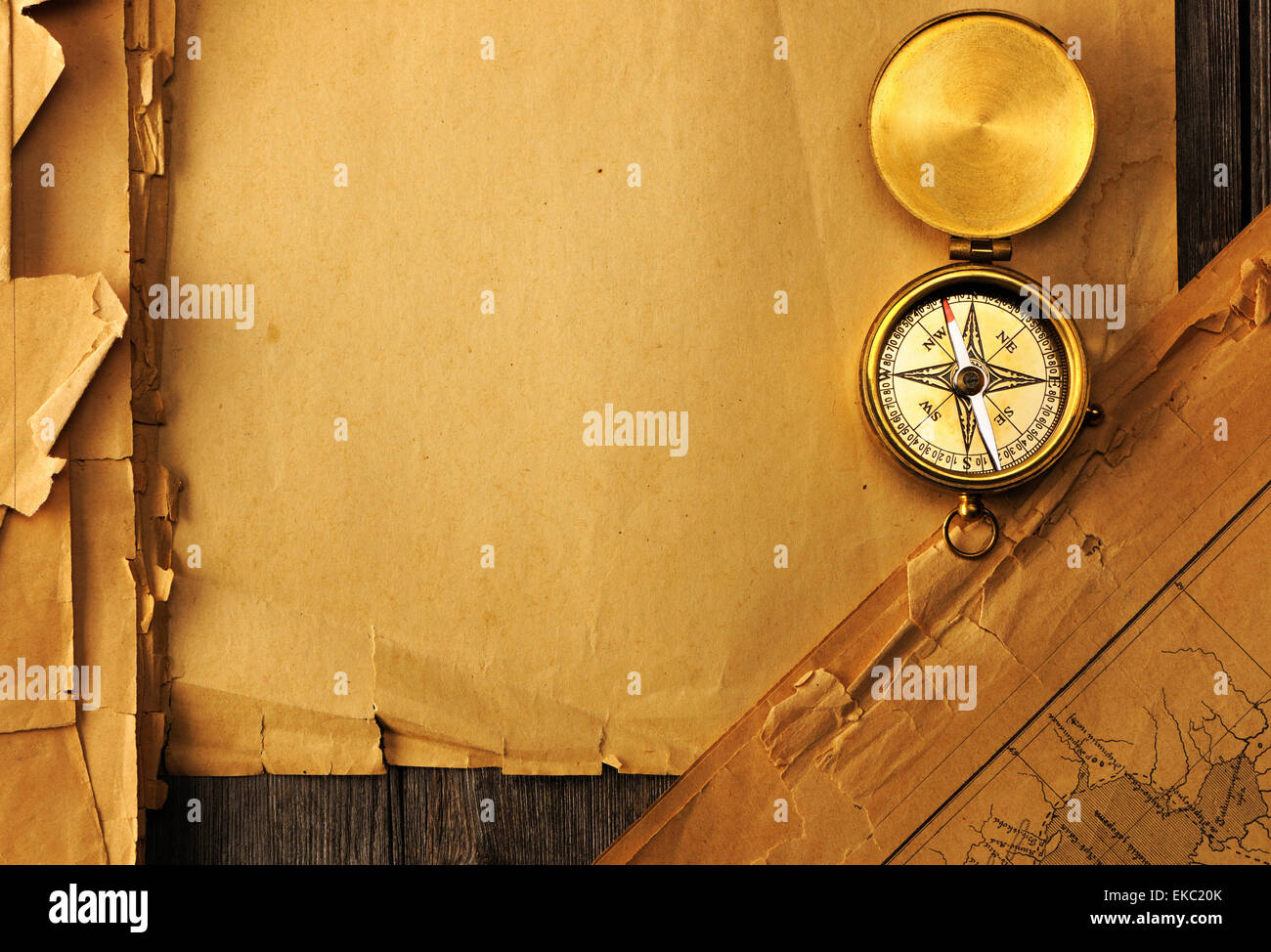 Antique compass over old map Stock Photo