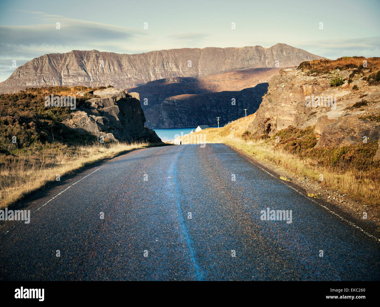 View of rural road and mountains, Assynt, North West Highlands, Scotland, UK Stock Photo