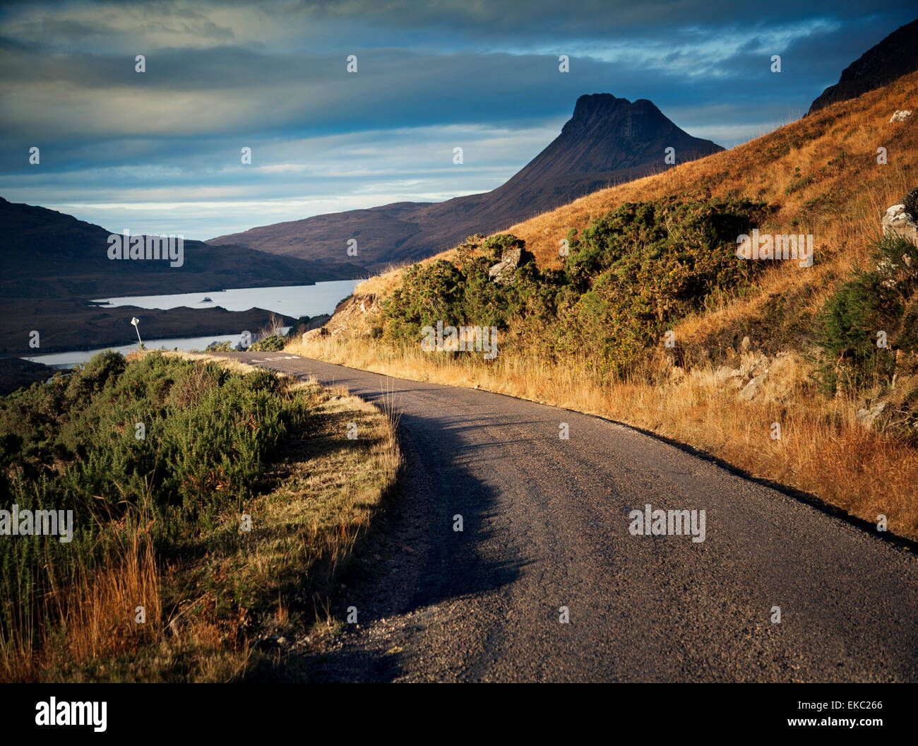 Rural road and view of Stac Pollaidh, Assynt, North West Highlands, Scotland, UK Stock Photo