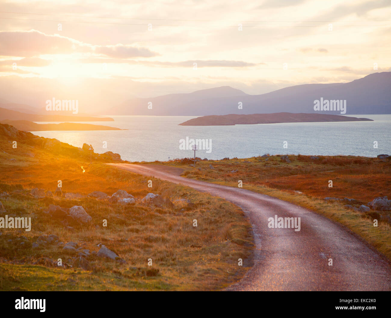 Rural road leading to loch, Assynt, Scotland Stock Photo