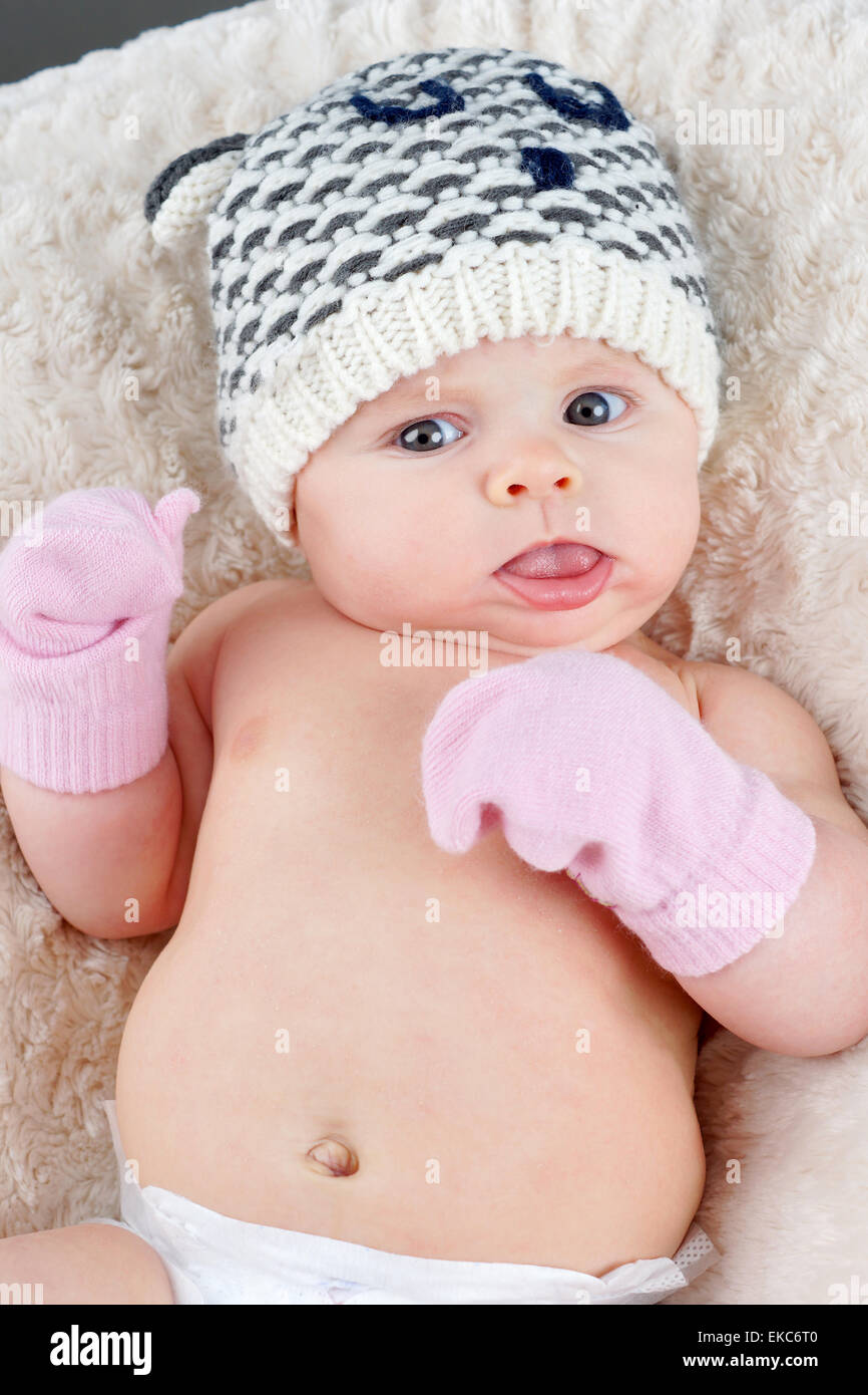 baby with mittens
