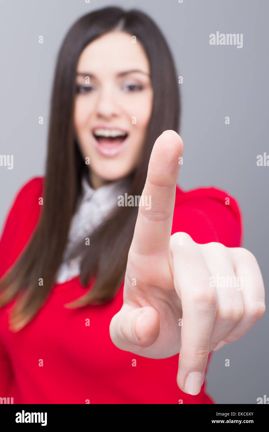 Woman in white shirt pointing hi-res stock photography and images - Alamy