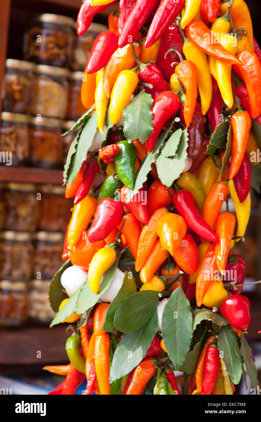 Bunch of multicolored hot peppers with a bay leaf on a market Stock ...