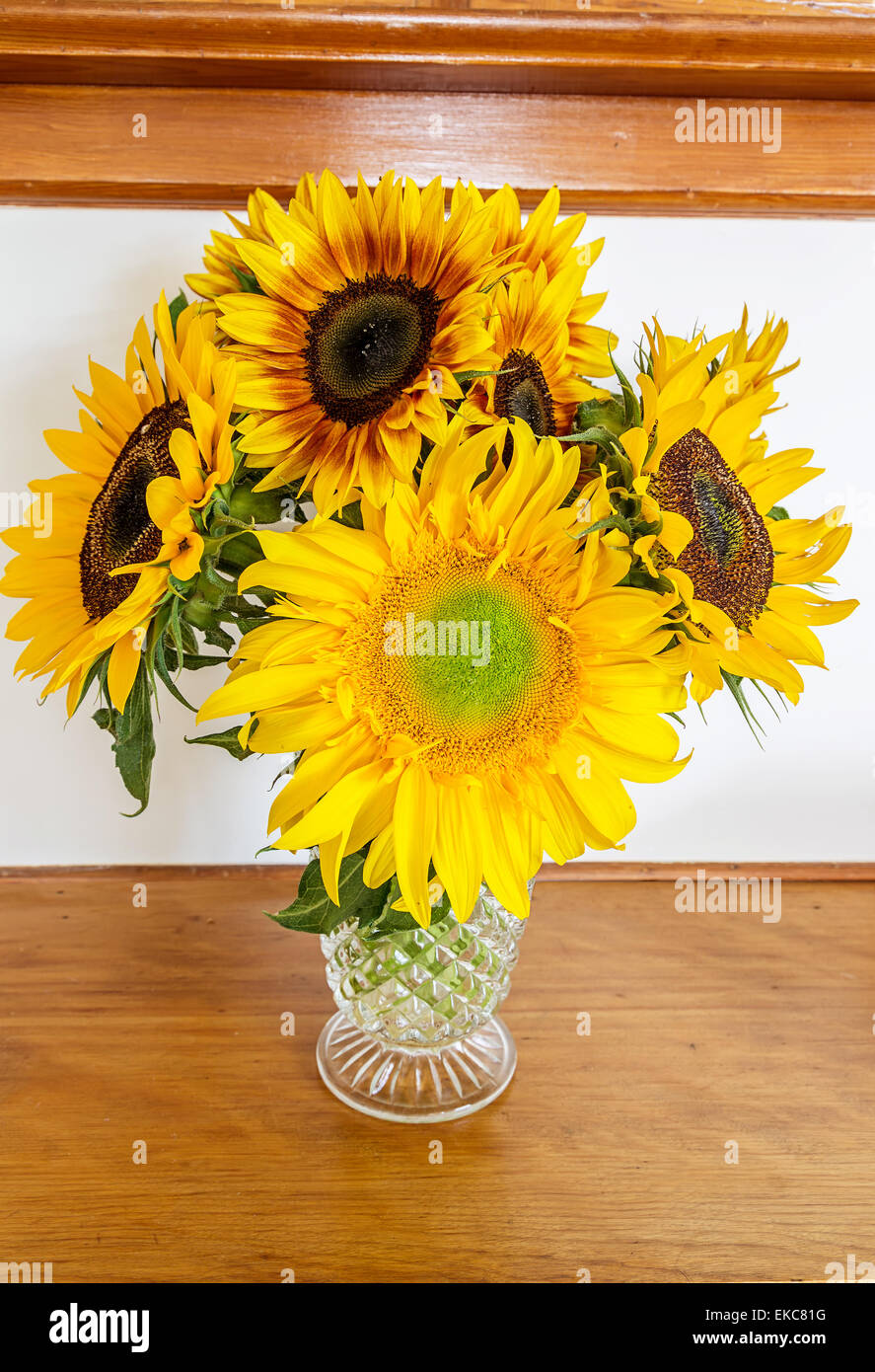 A bouquet of sunflowers in an ornate glass antique vase Stock Photo - Alamy