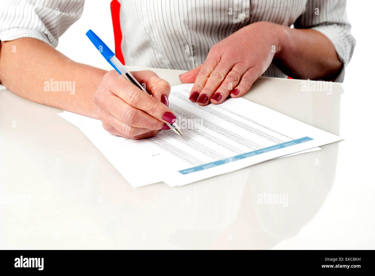 Woman reviewing and verifying employee records Stock Photo