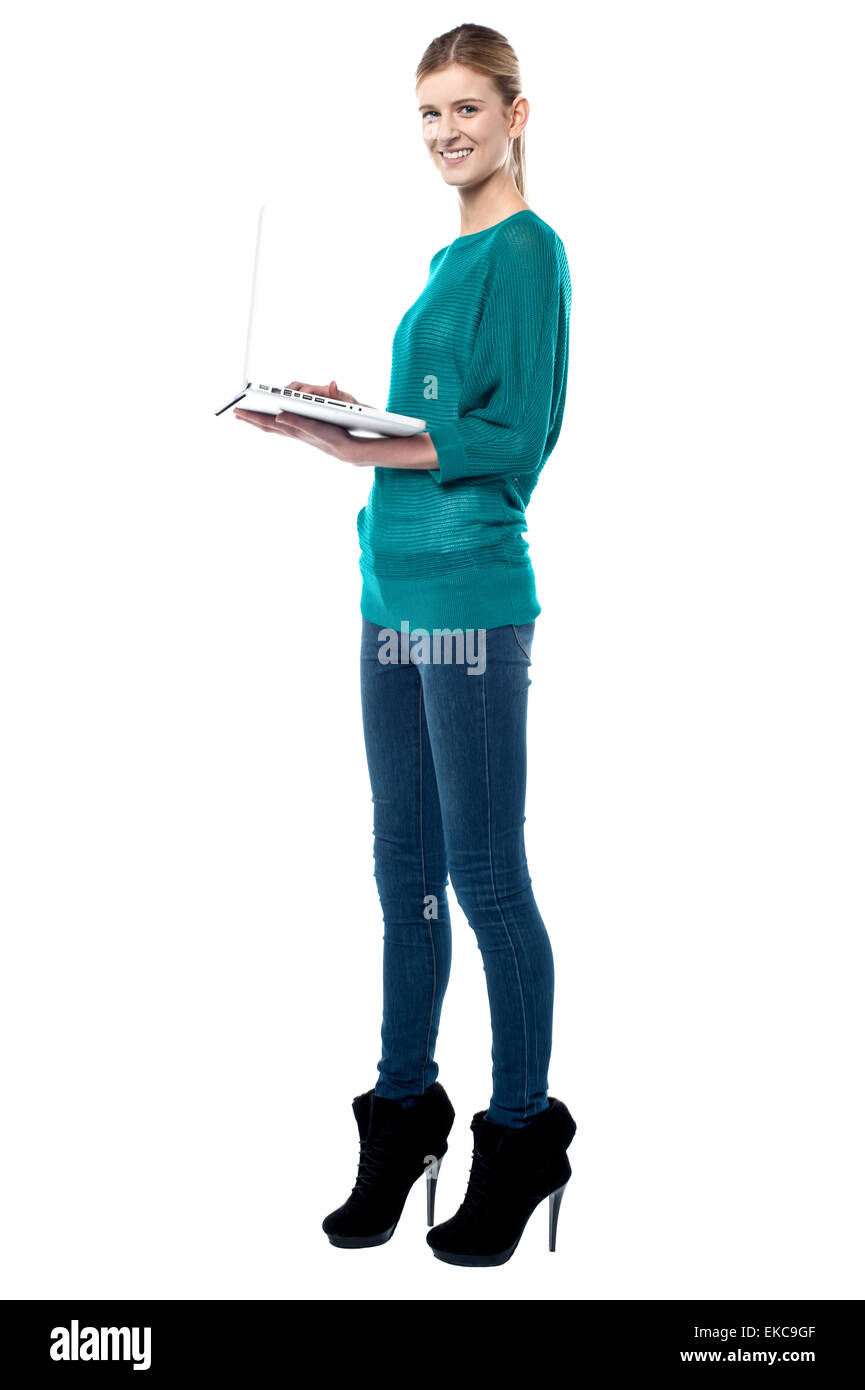 Teen browsing internet on her laptop Stock Photo - Alamy