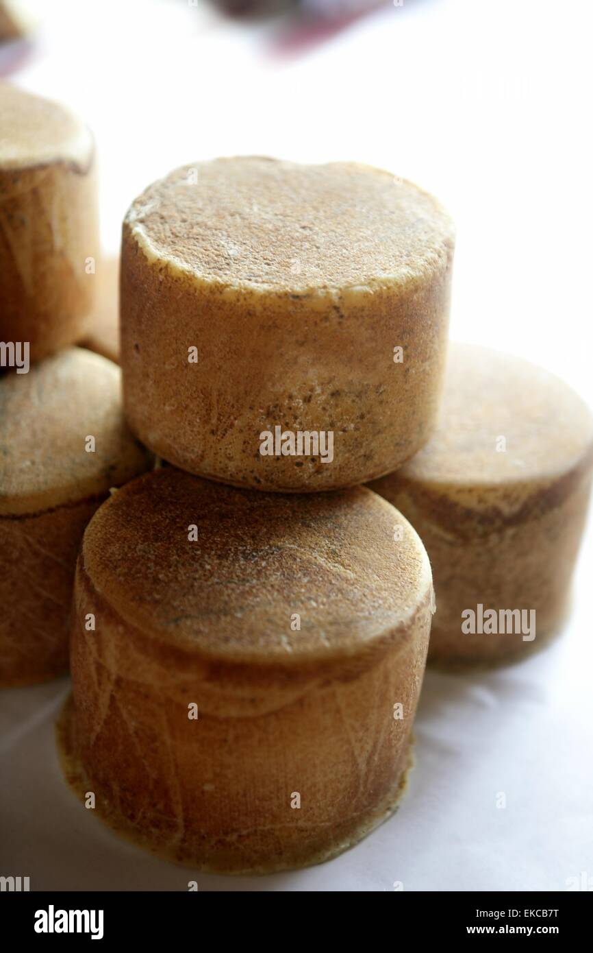 Aged french cheese wheels stacked Stock Photo Alamy