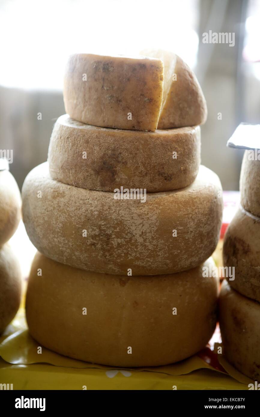 Aged french cheese wheels stacked Stock Photo Alamy