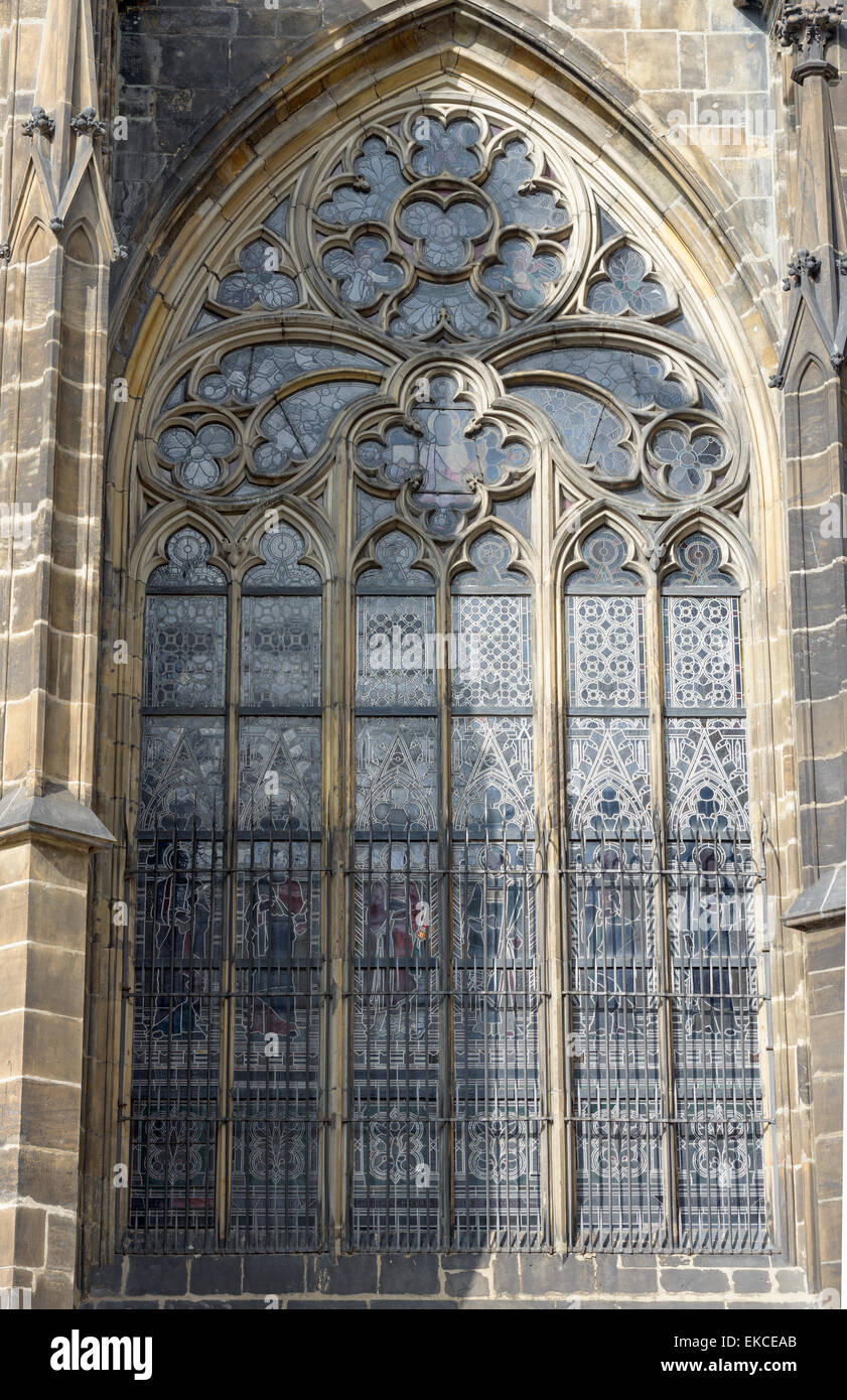 Exterior view of stained-glass window with tracery of cut stone in lancet pointed arch of St. Vitus Cathedral, Prague, Czech Rep Stock Photo