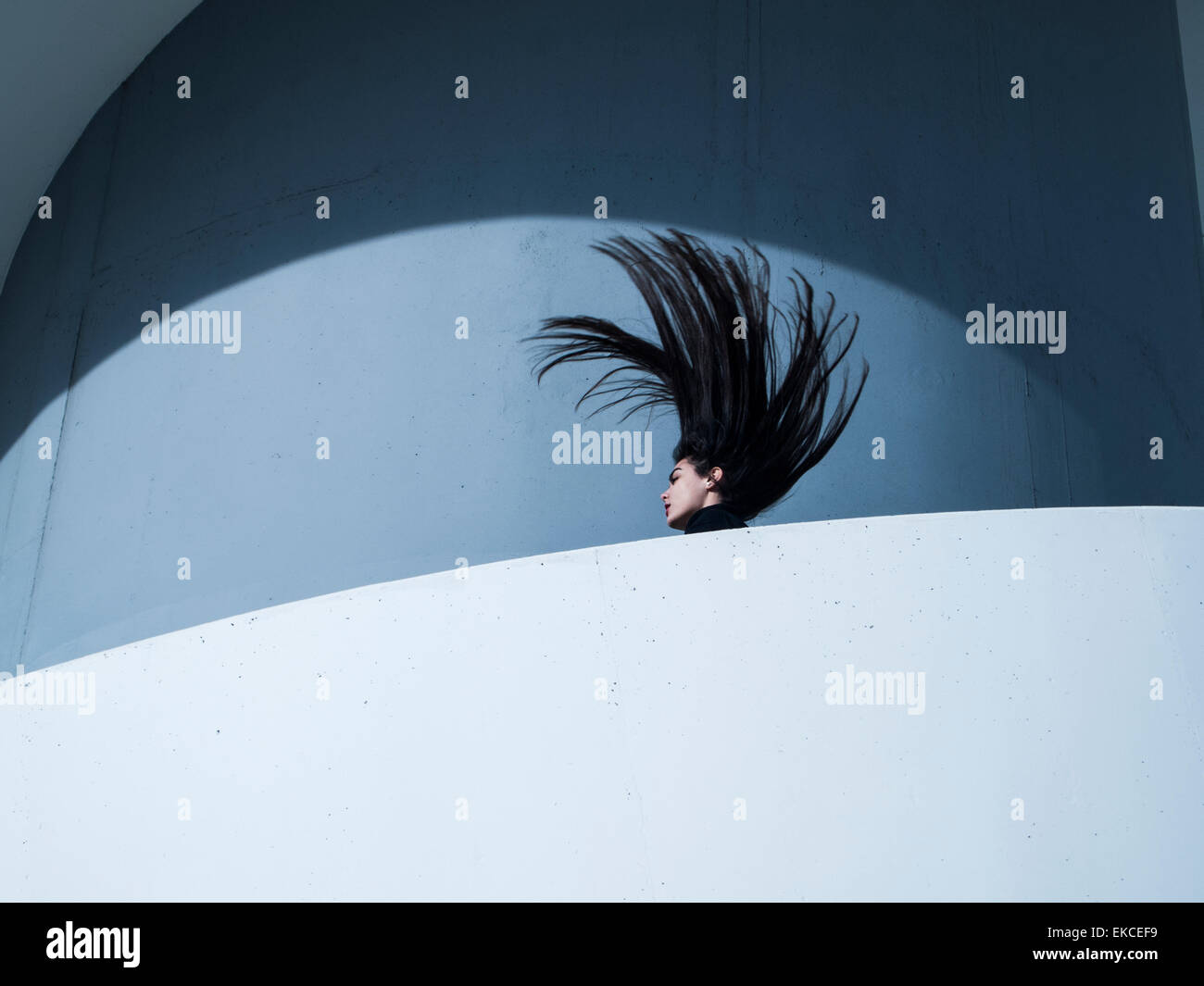 Young woman throwing her head back Stock Photo
