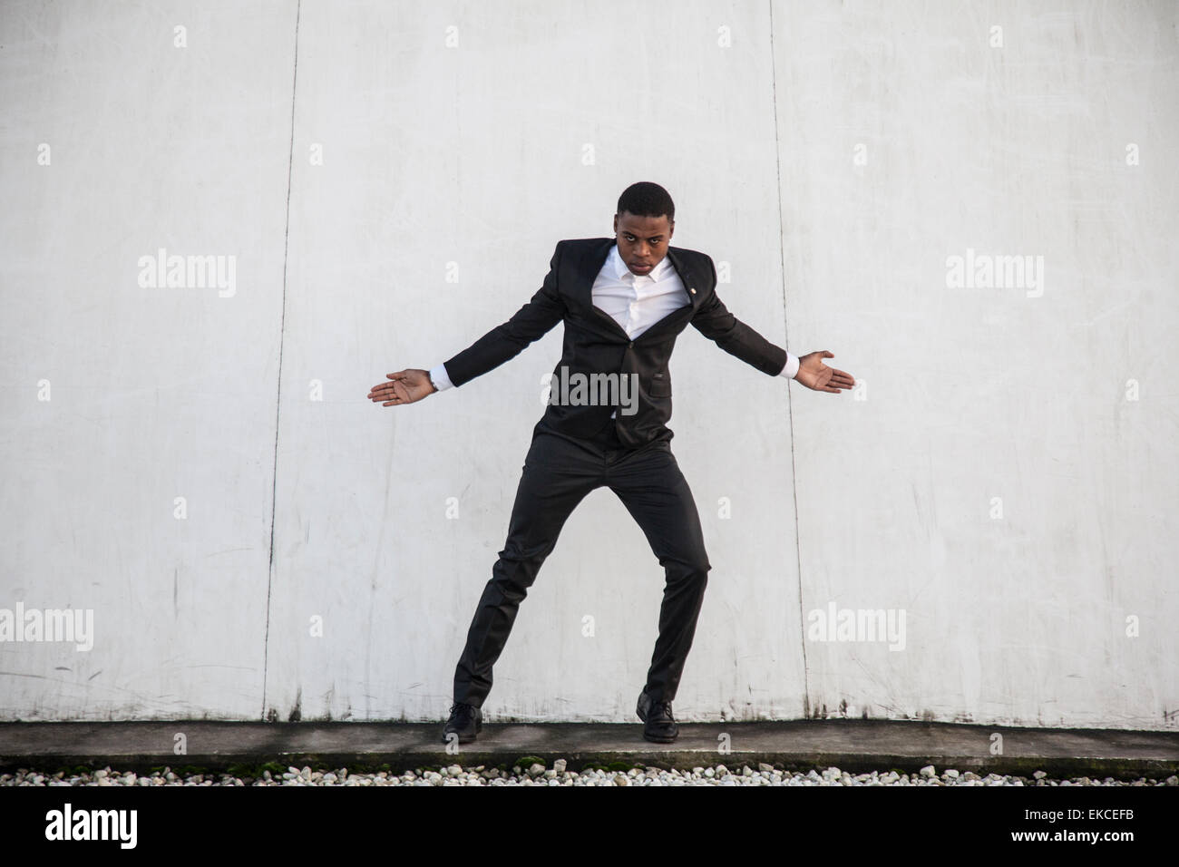 Young man in a suit street dancing Stock Photo