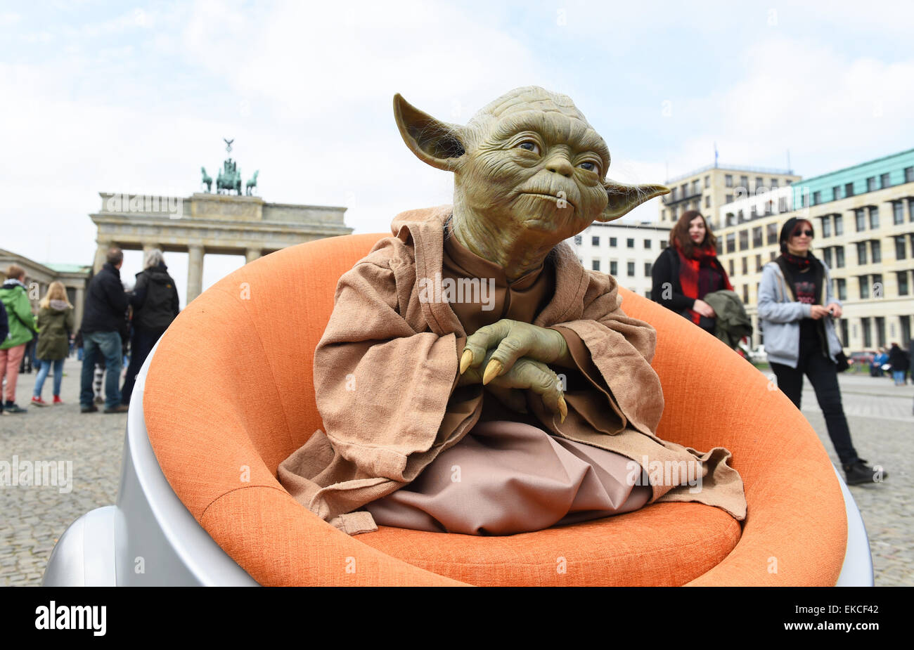 Berlin, Germany. 09th Apr, 2015. The waxwork of Jedi Master Yoda from the Star Wars saga, from Madam Tussauds Berlin in front of the Brandenburg Gate in Berlin, Germany, 9 April 2015. This and other Star Wars figures will be on show from May 2015. Credit:  dpa picture alliance/Alamy Live News Stock Photo