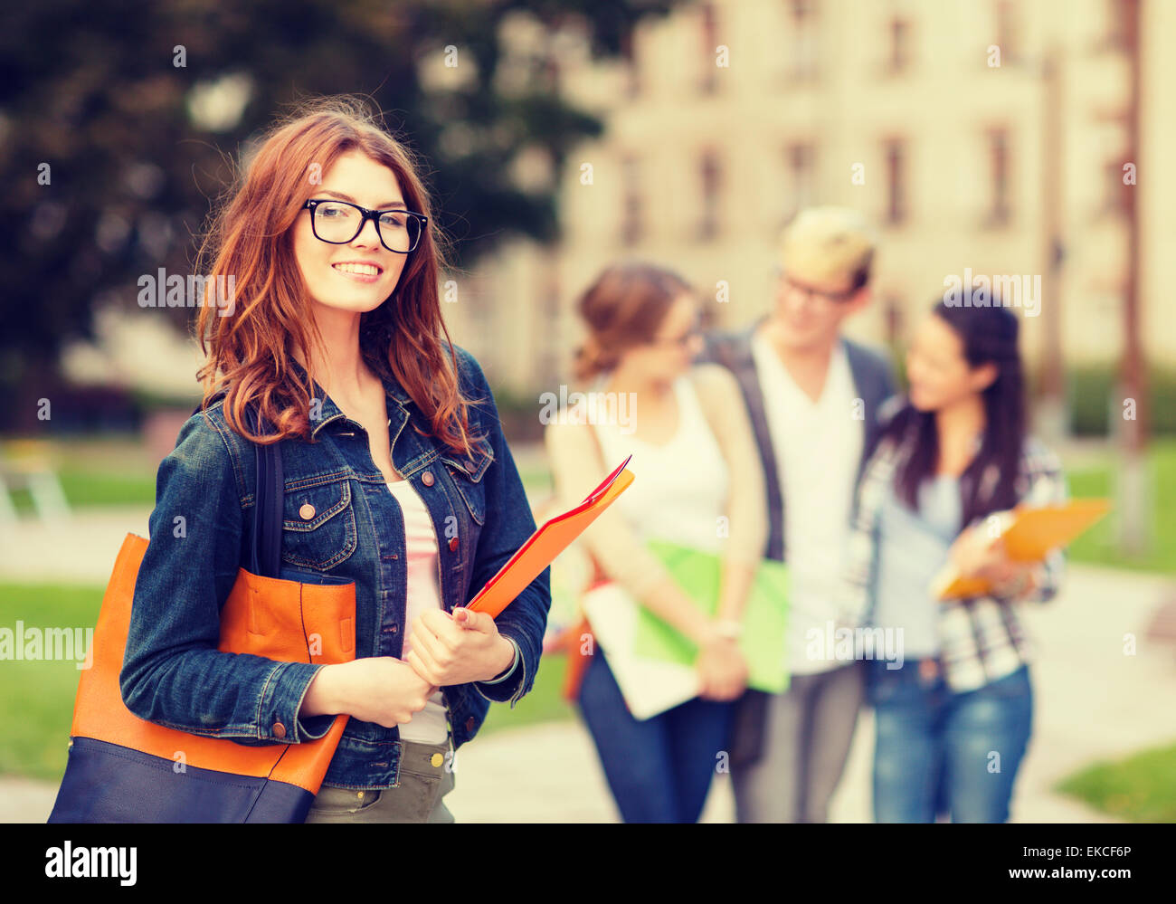 female student in eyglasses with folders Stock Photo - Alamy