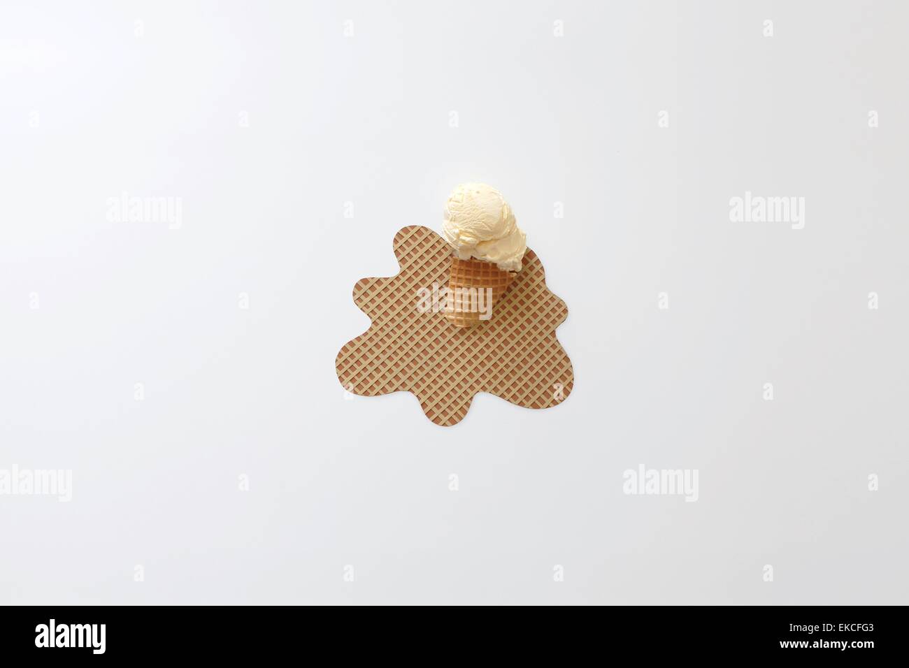 Conceptual Ice-cream cone melting Stock Photo
