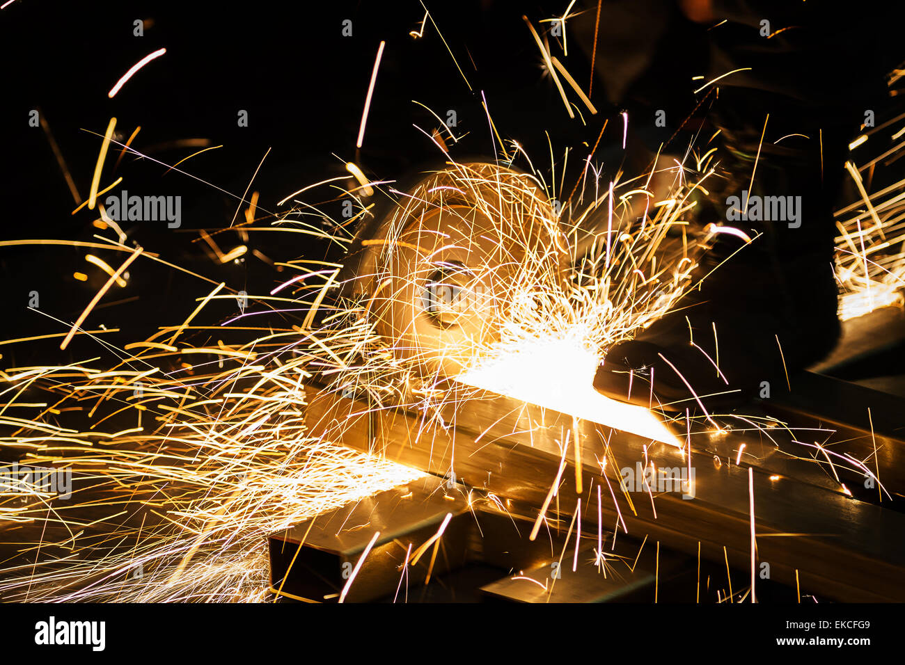 Sharpening and cutting of iron by an abrasive disc machine Stock Photo ...