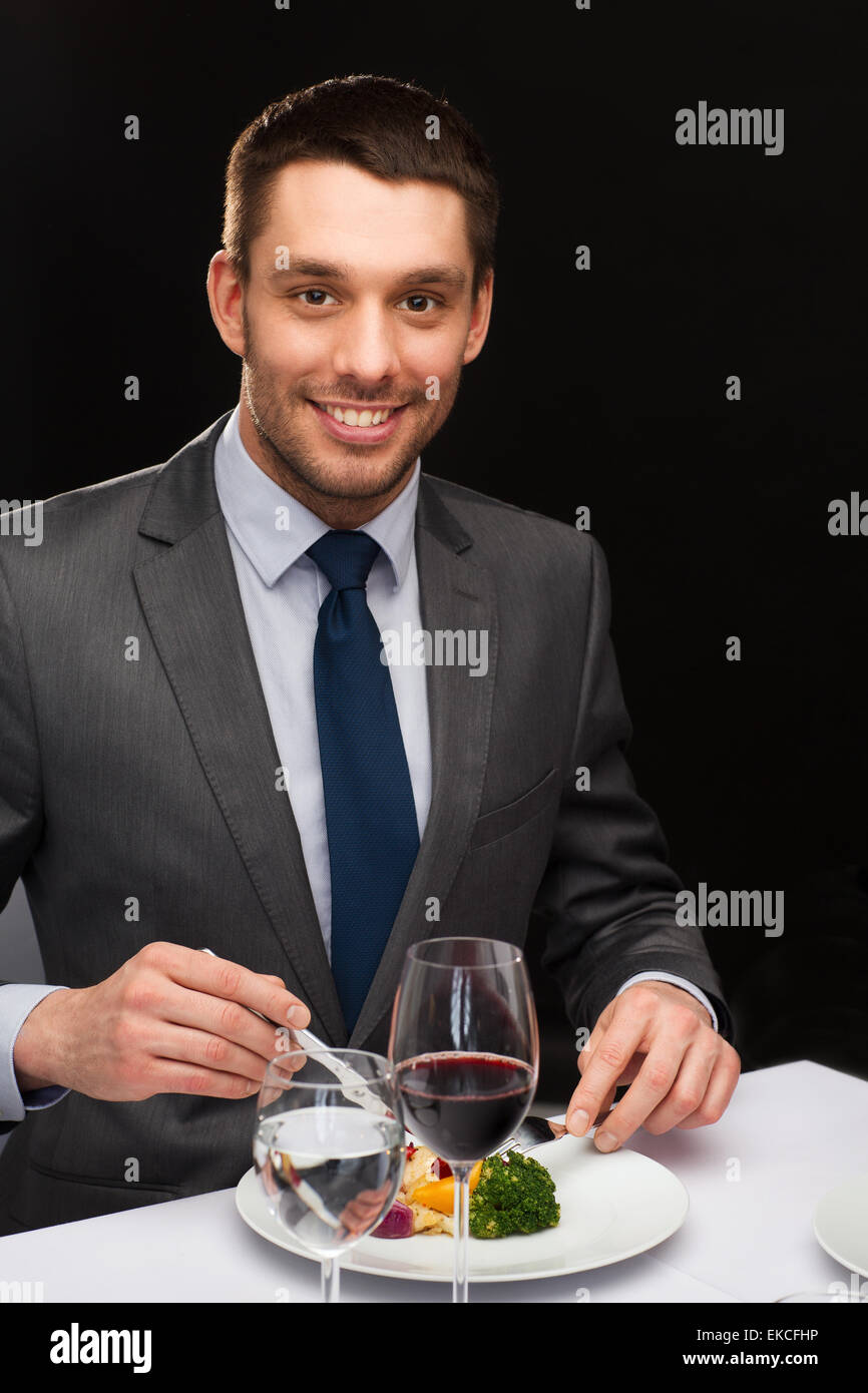 smiling man eating main course Stock Photo Alamy smiling man eating main course Stock Photo Alamy