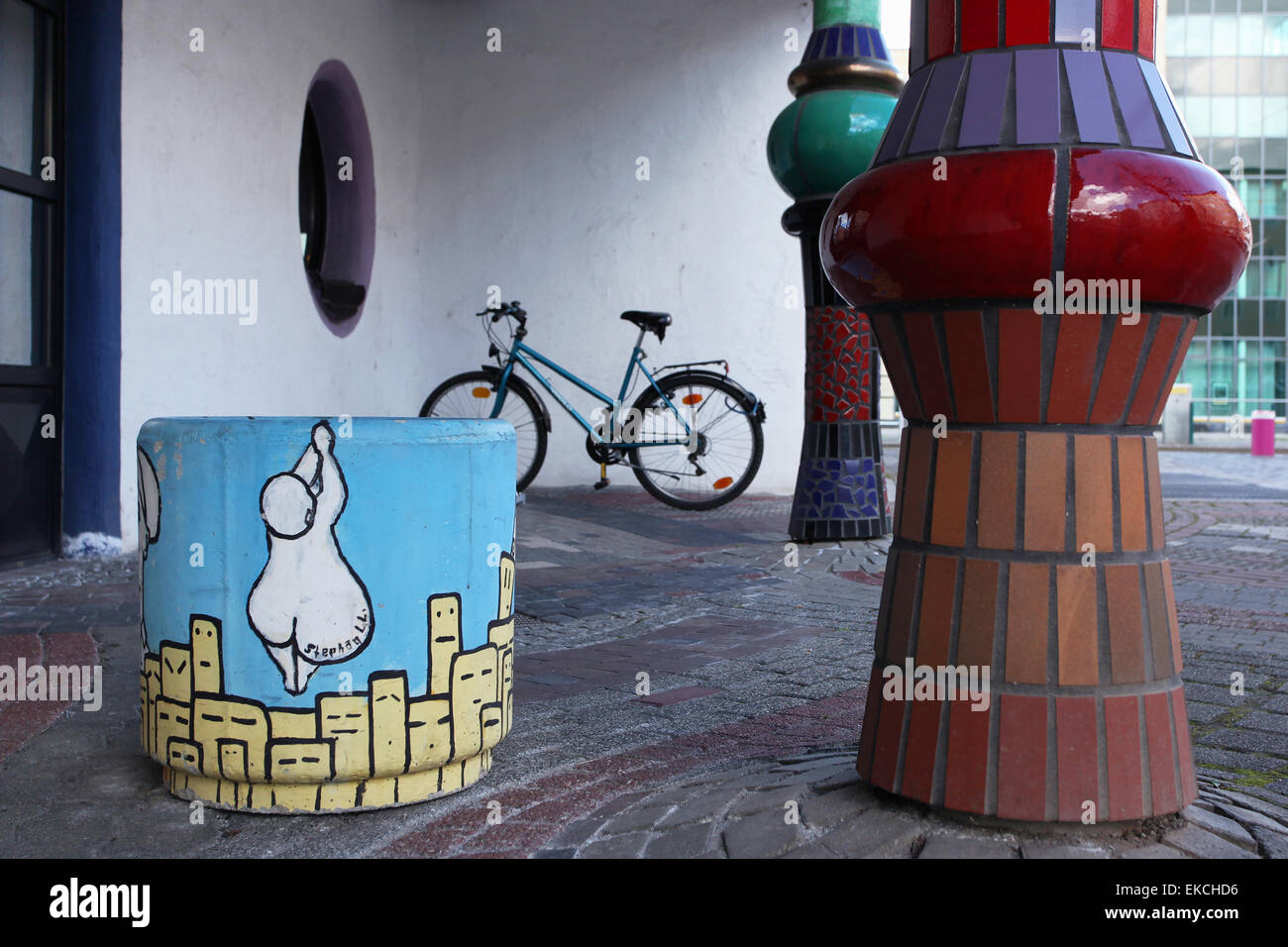 Painted waste bin at the Green Citadel, designed by the architect Friedensreich Hundertwasser. Magdeburg, Germany. Stock Photo