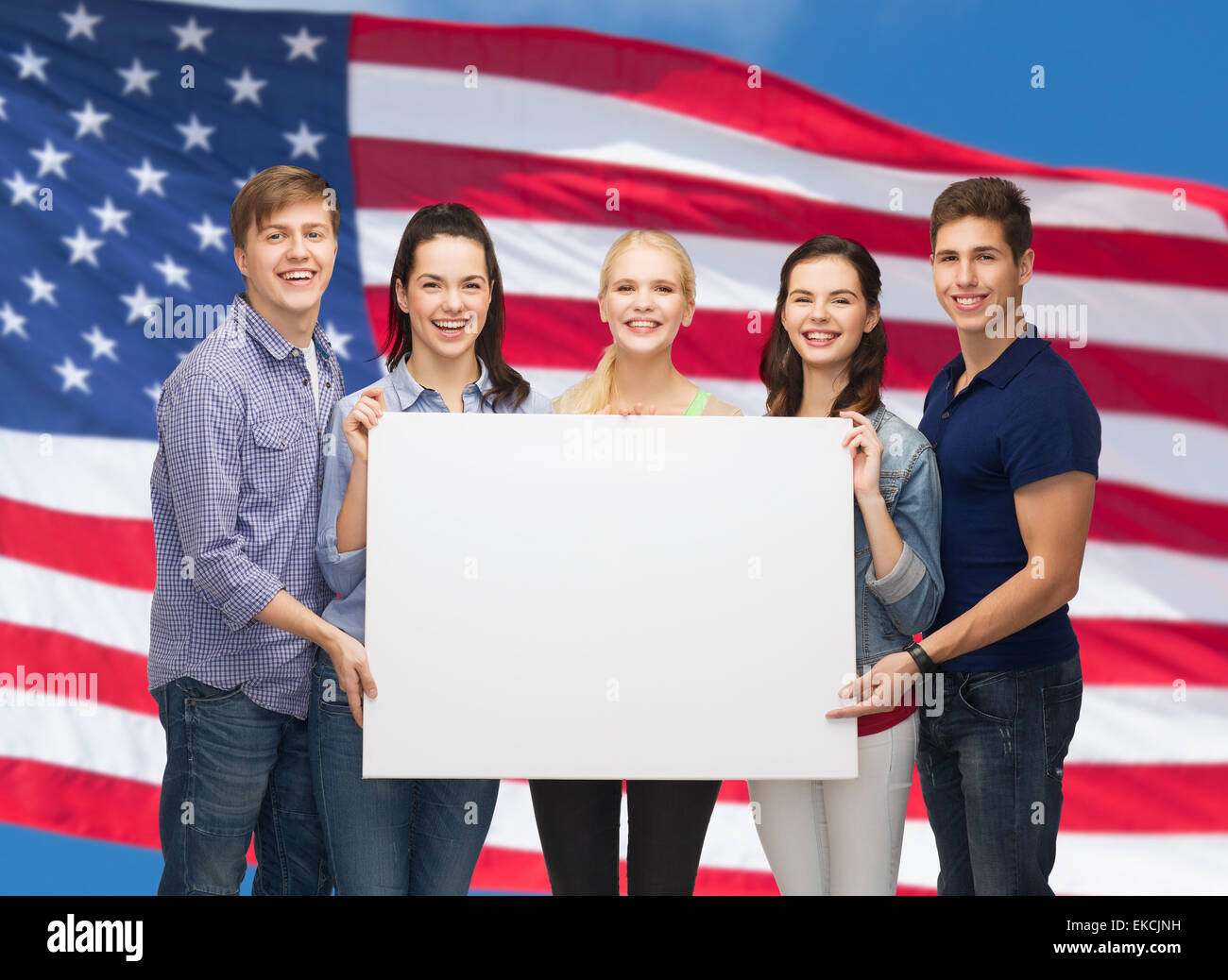 group of standing students with blank white board Stock Photo - Alamy