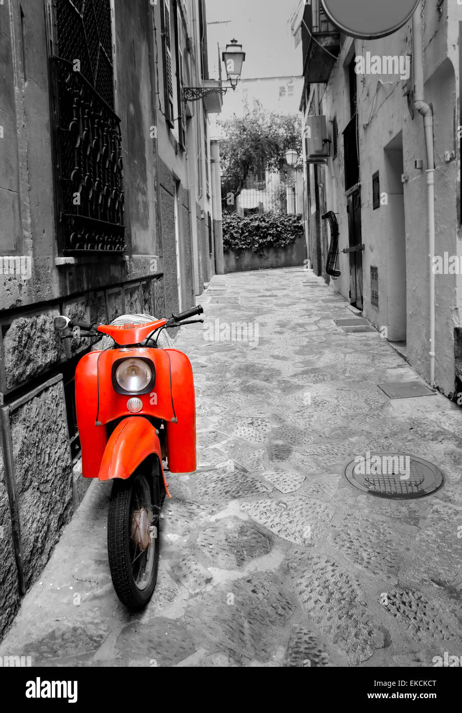 Mediterranean street with old retro red scooter in Mallorca Stock Photo