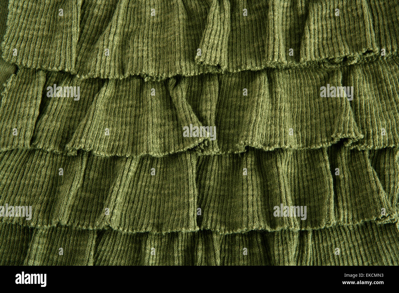 pleated skirt fabric fashion in green closeup Stock Photo