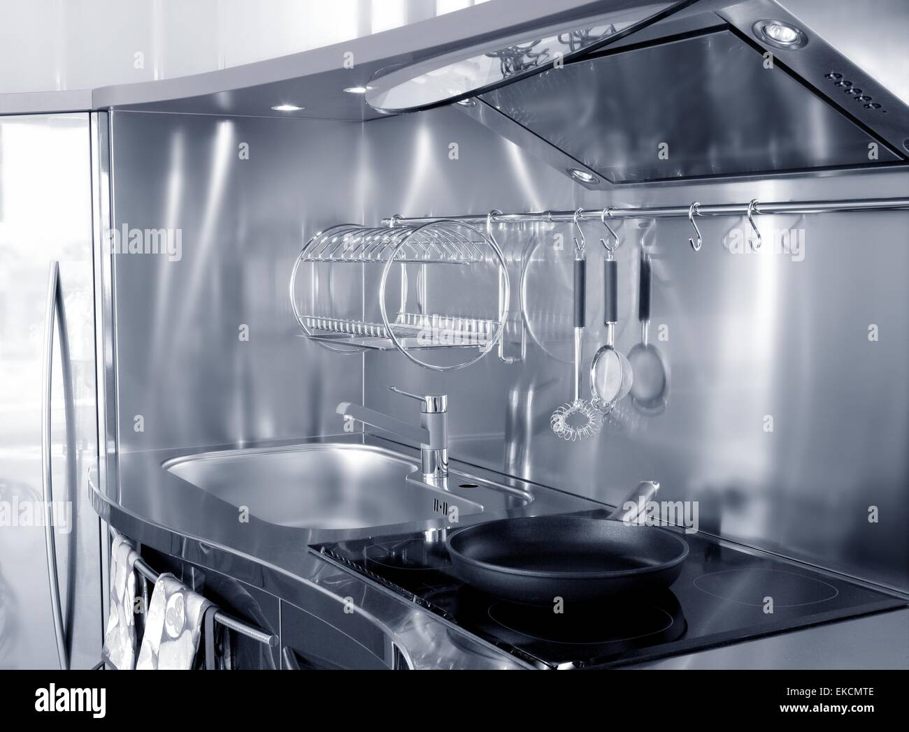 Kitchen silver sink and vitroceramic stove hob Stock Photo Alamy