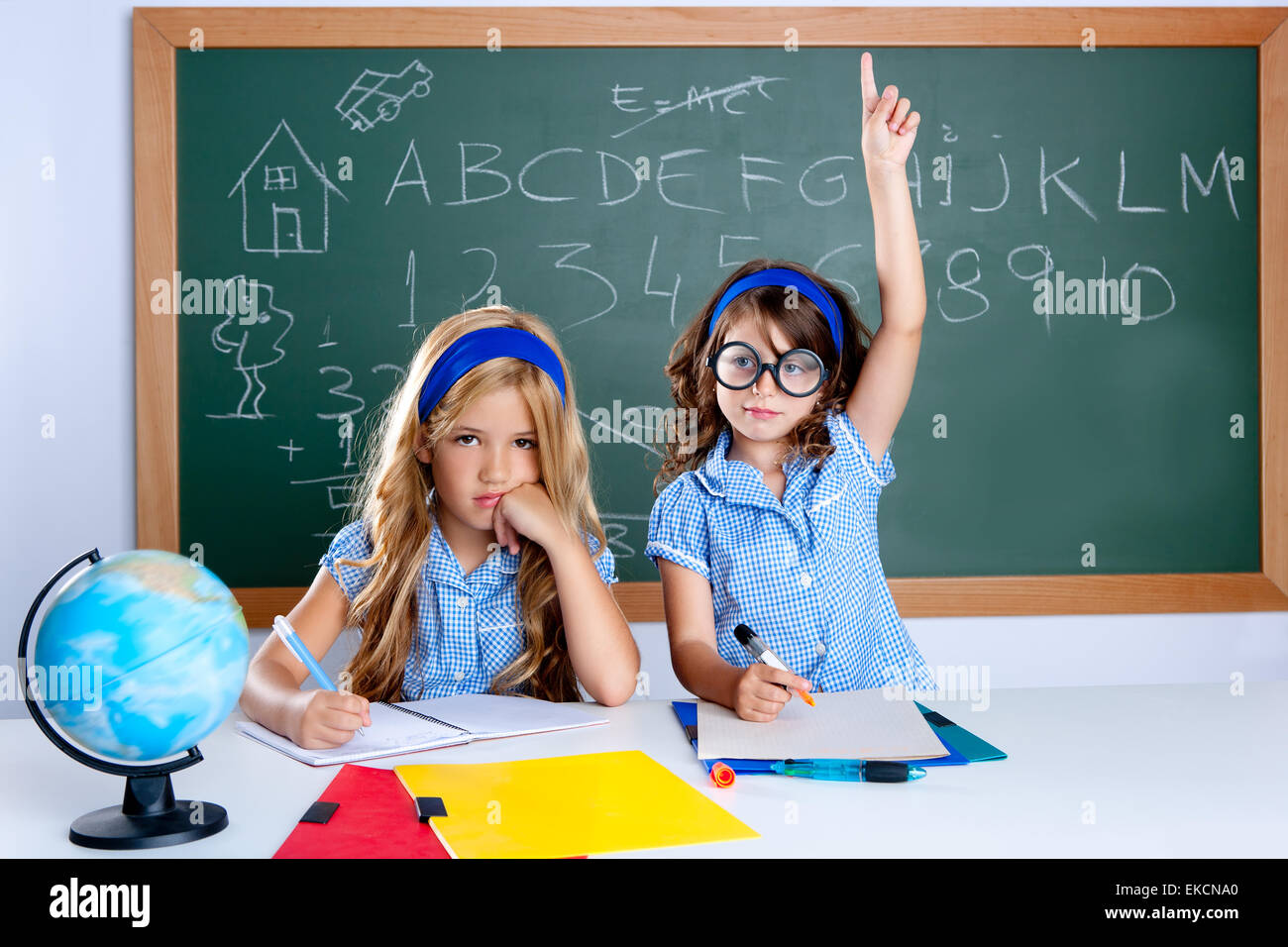 clever nerd student girl in classroom raising hand Stock Photo: 80800104 - Alamy