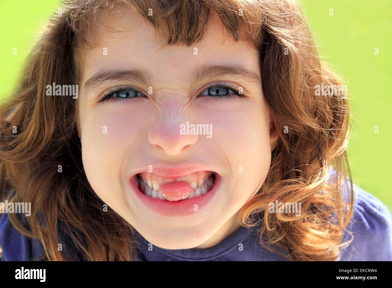 indented girl sticking tongue between teeth Stock Photo Alamy