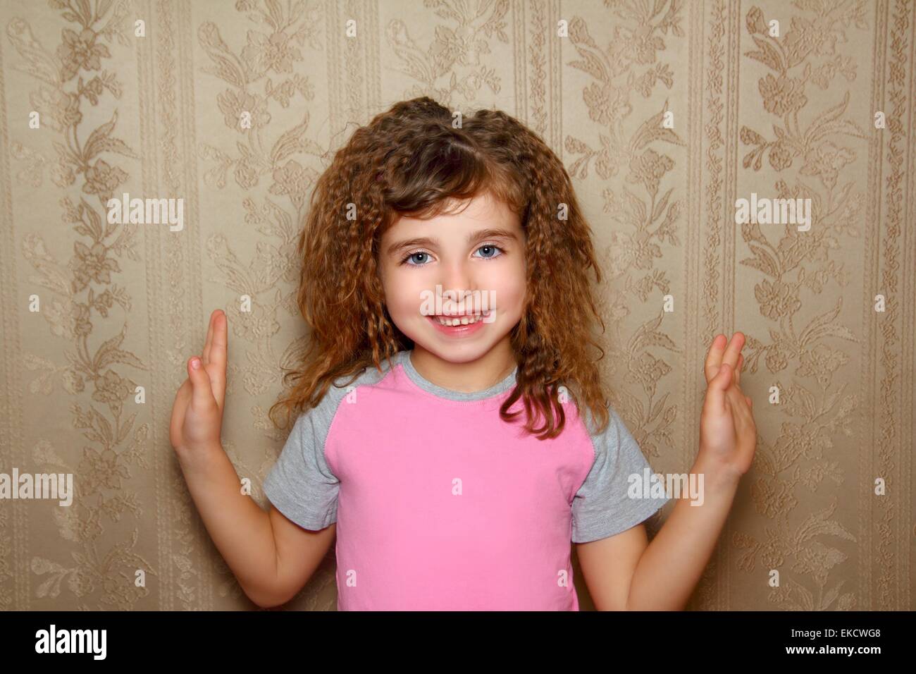 little girl happy funny expression on vintage wallpaper Stock Photo Alamy