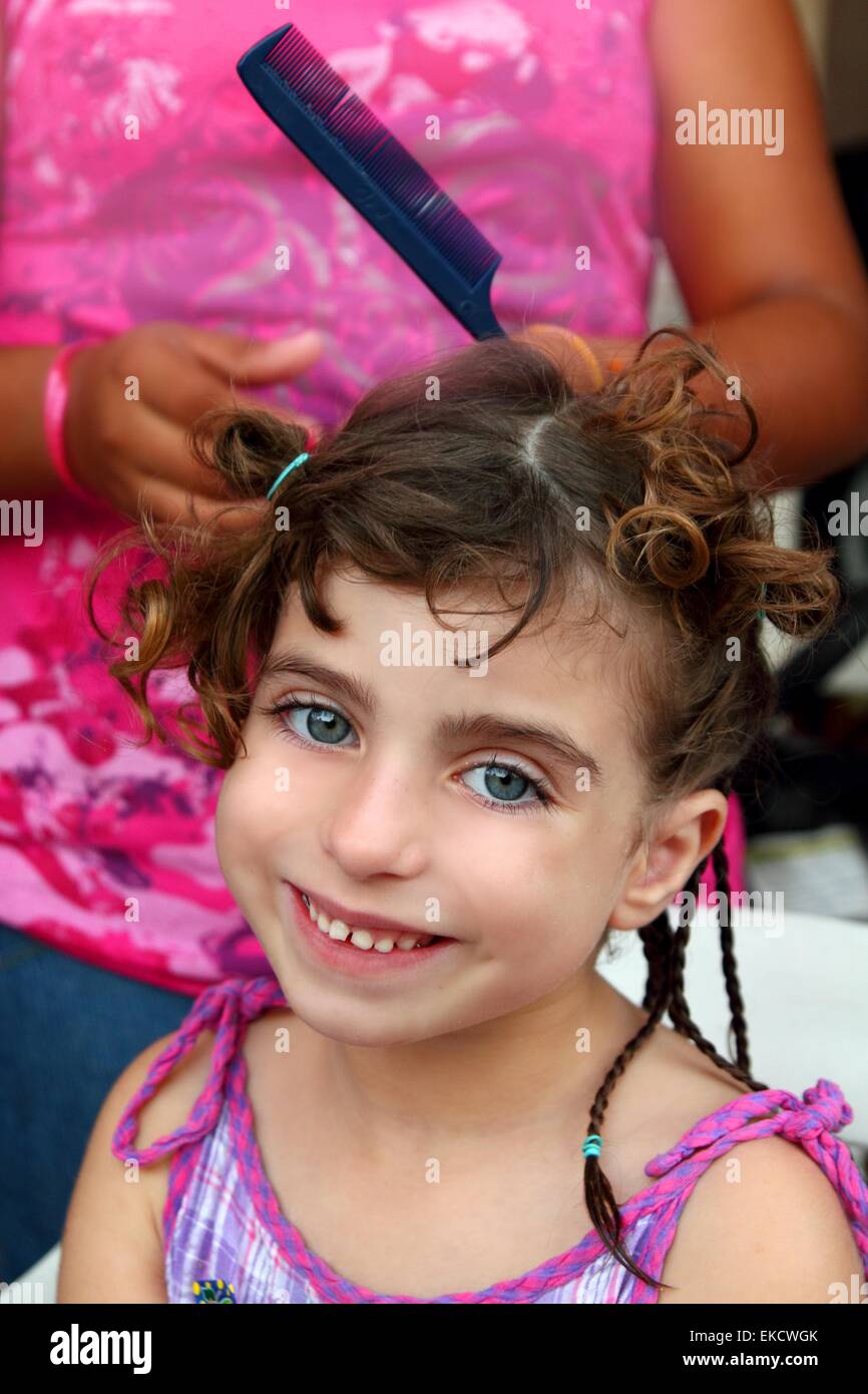 Little Girl In Hairdresser Preparing Braided Hair Stock Photo