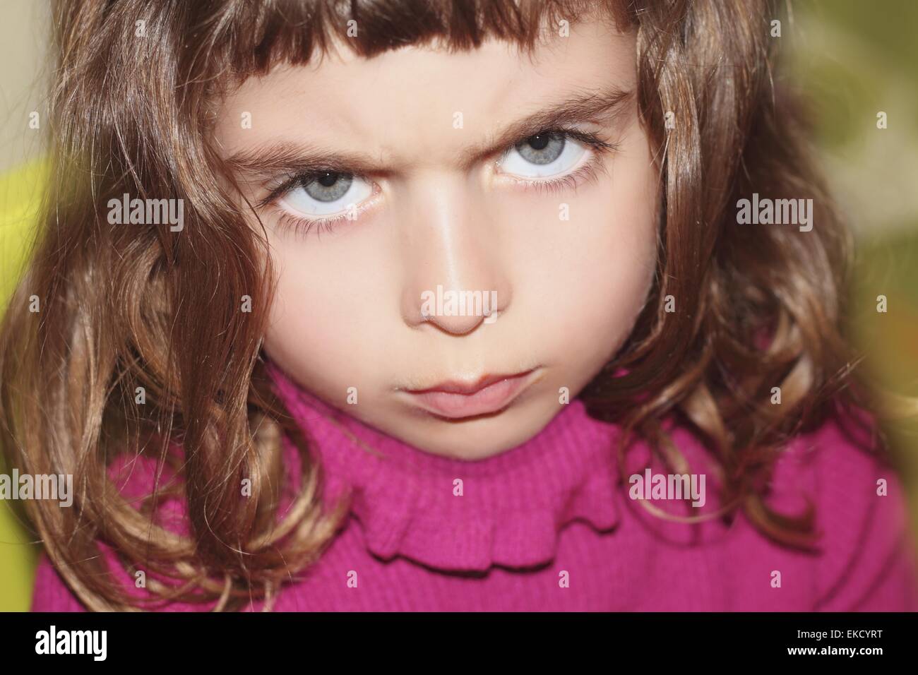 defy outface little girl portrait looking gesture Stock Photo