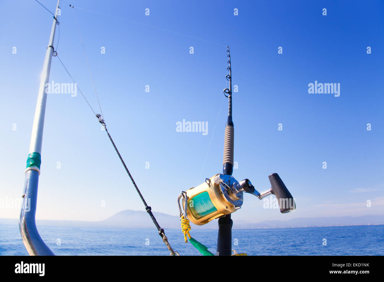 fishing boat trolling with outrigger gear Stock Photo - Alamy