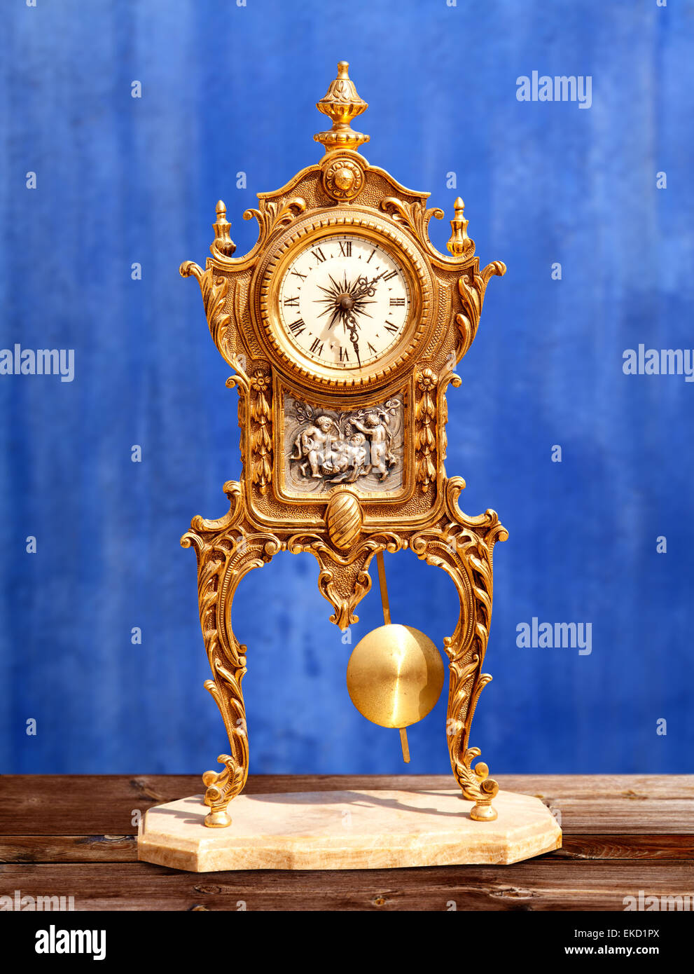 ancient vintage golden brass pendulum clock Stock Photo Alamy
