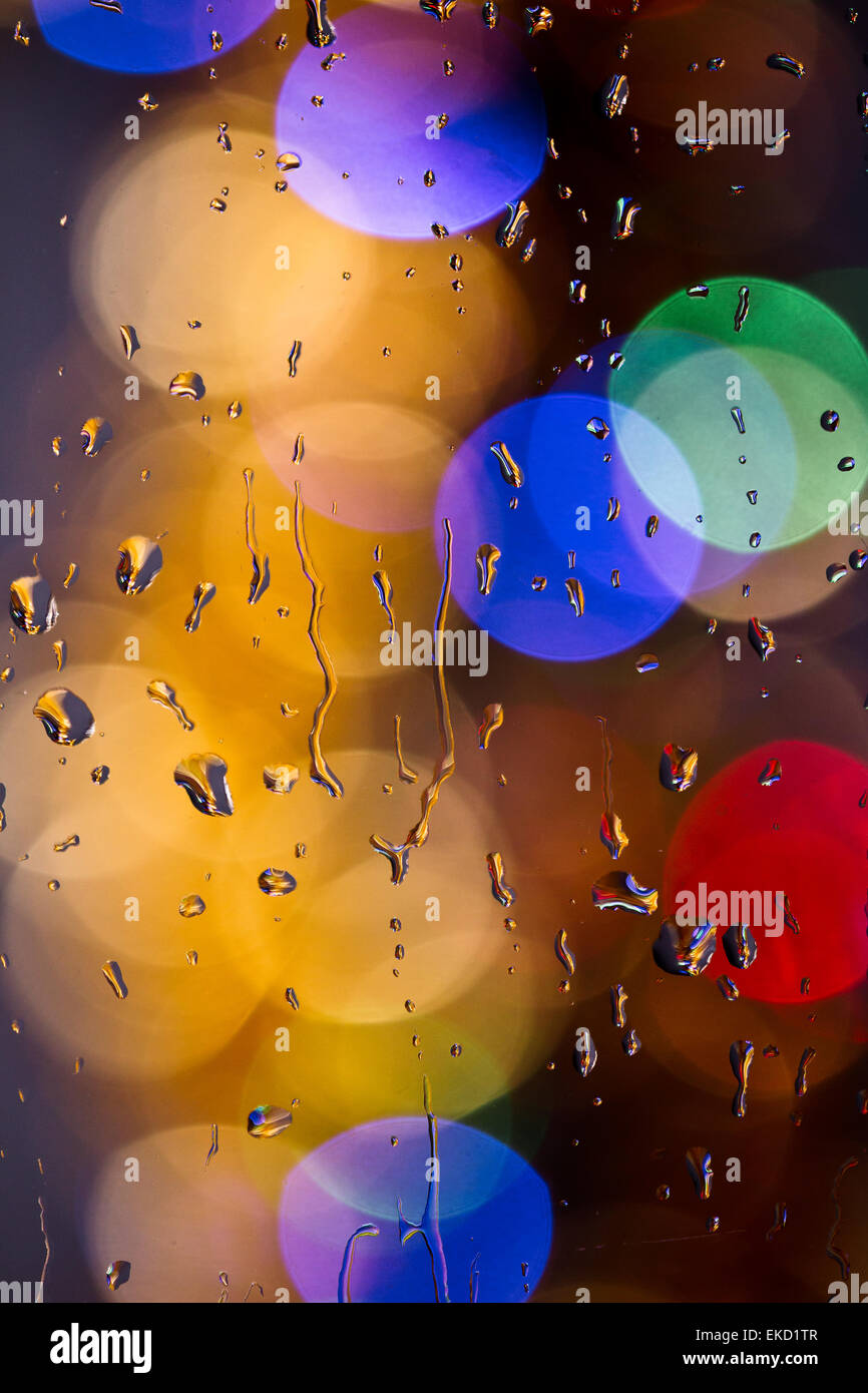 Drops of rain on window with bokeh lights abstract Stock Photo - Alamy