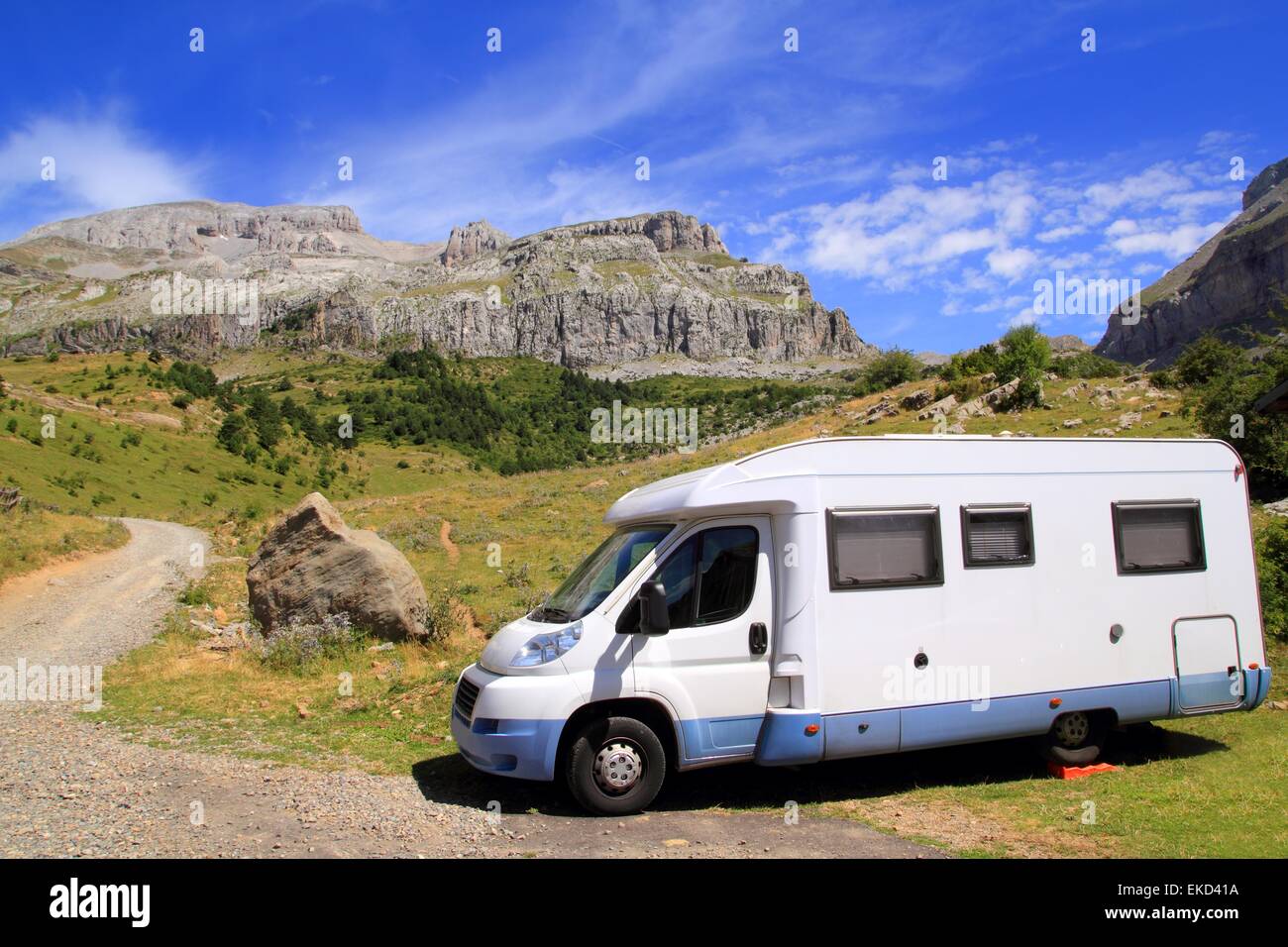 Camper van in mountains blue sky Stock Photo - Alamy
