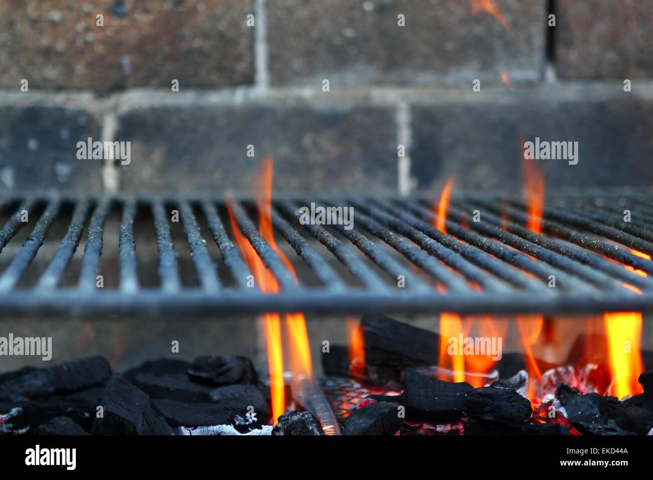 Bar b cue barbecue fire BBQ coal fire iron grill Stock Photo Alamy