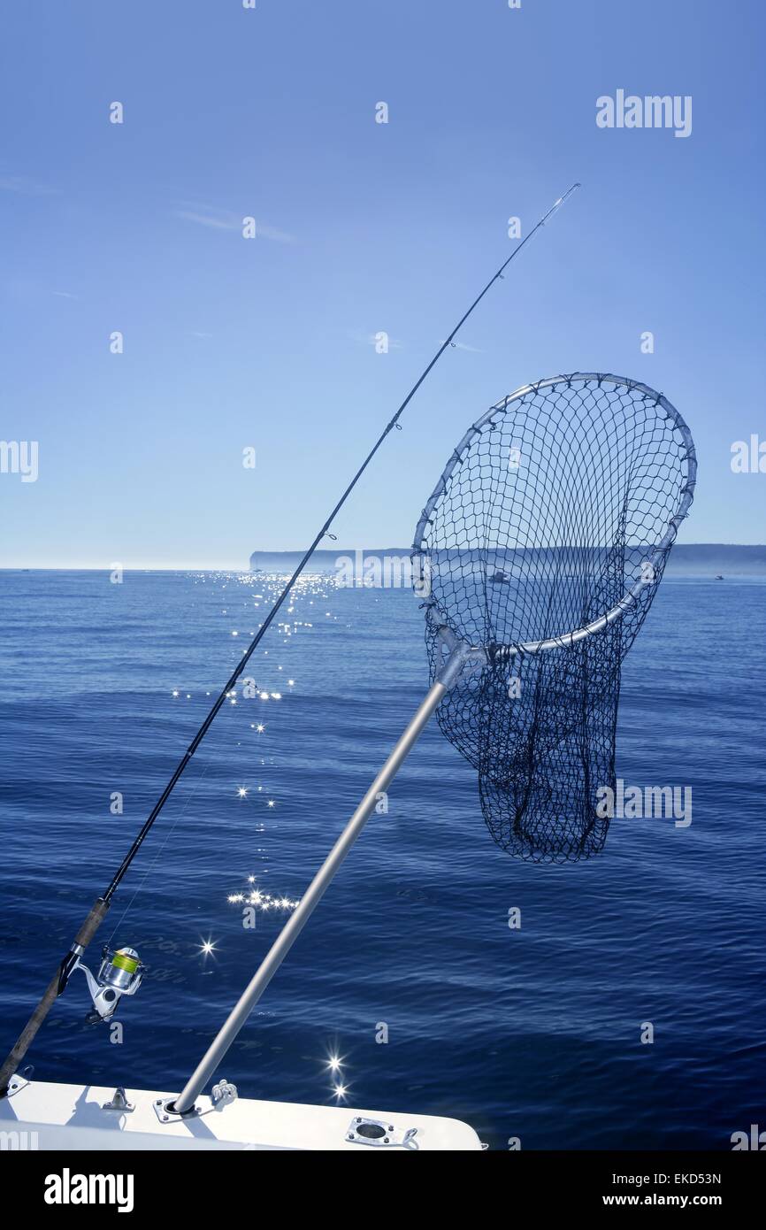 Fishing scoop net on boat in blue sea Stock Photo - Alamy