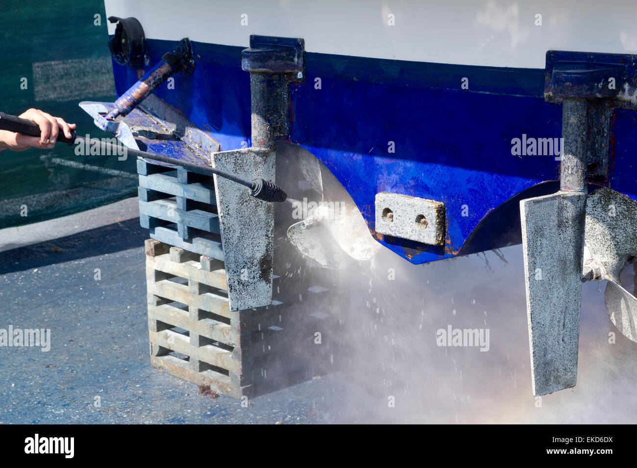 blue boat hull cleaning pressure washer barnacles Stock Photo Alamy