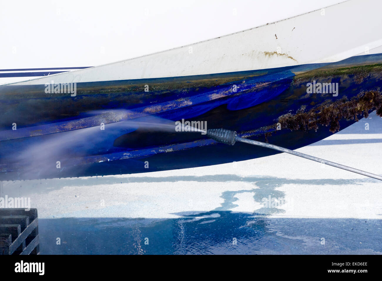 blue boat hull cleaning pressure washer barnacles Stock Photo Alamy