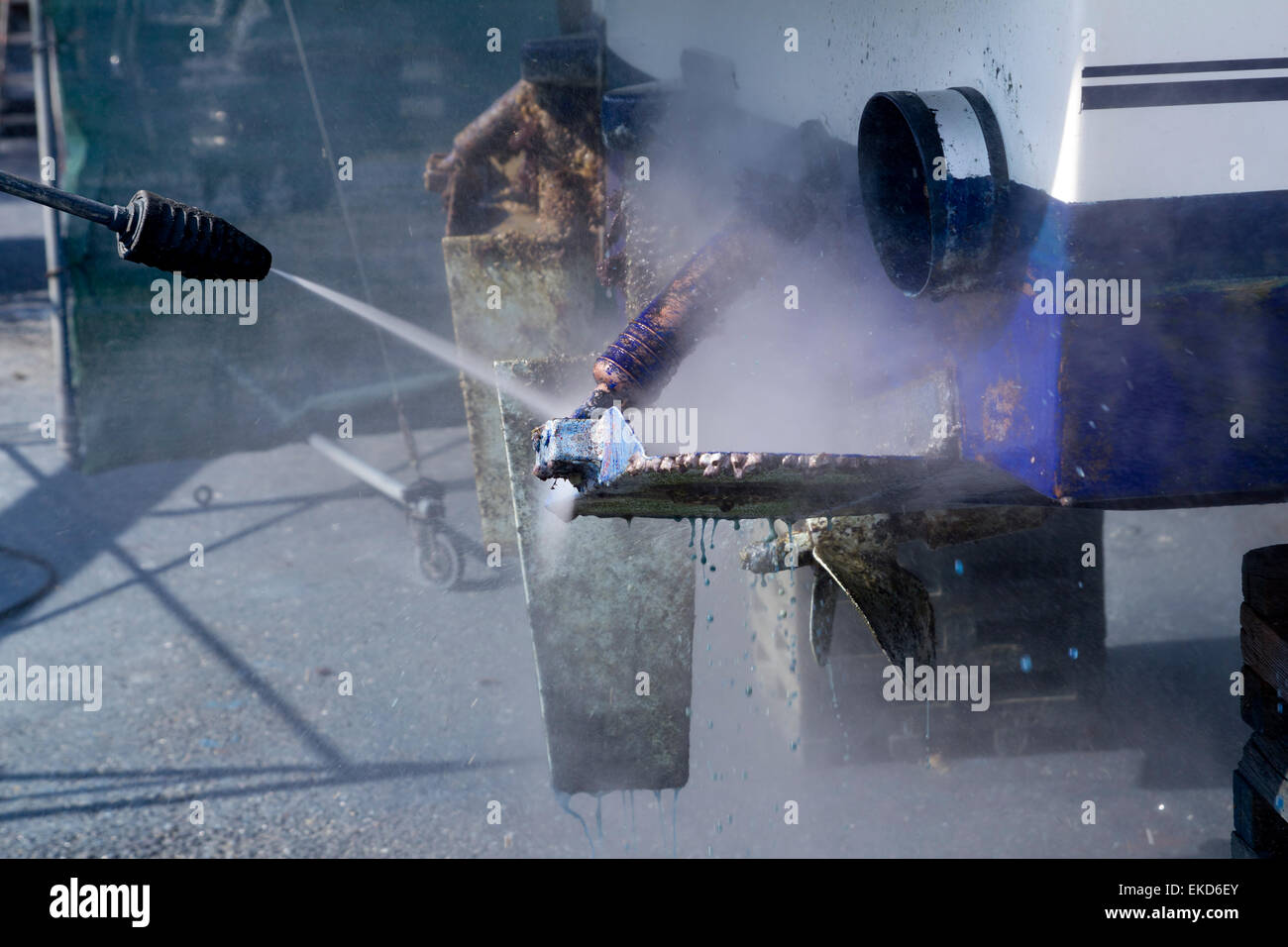 blue boat hull cleaning pressure washer barnacles Stock Photo Alamy