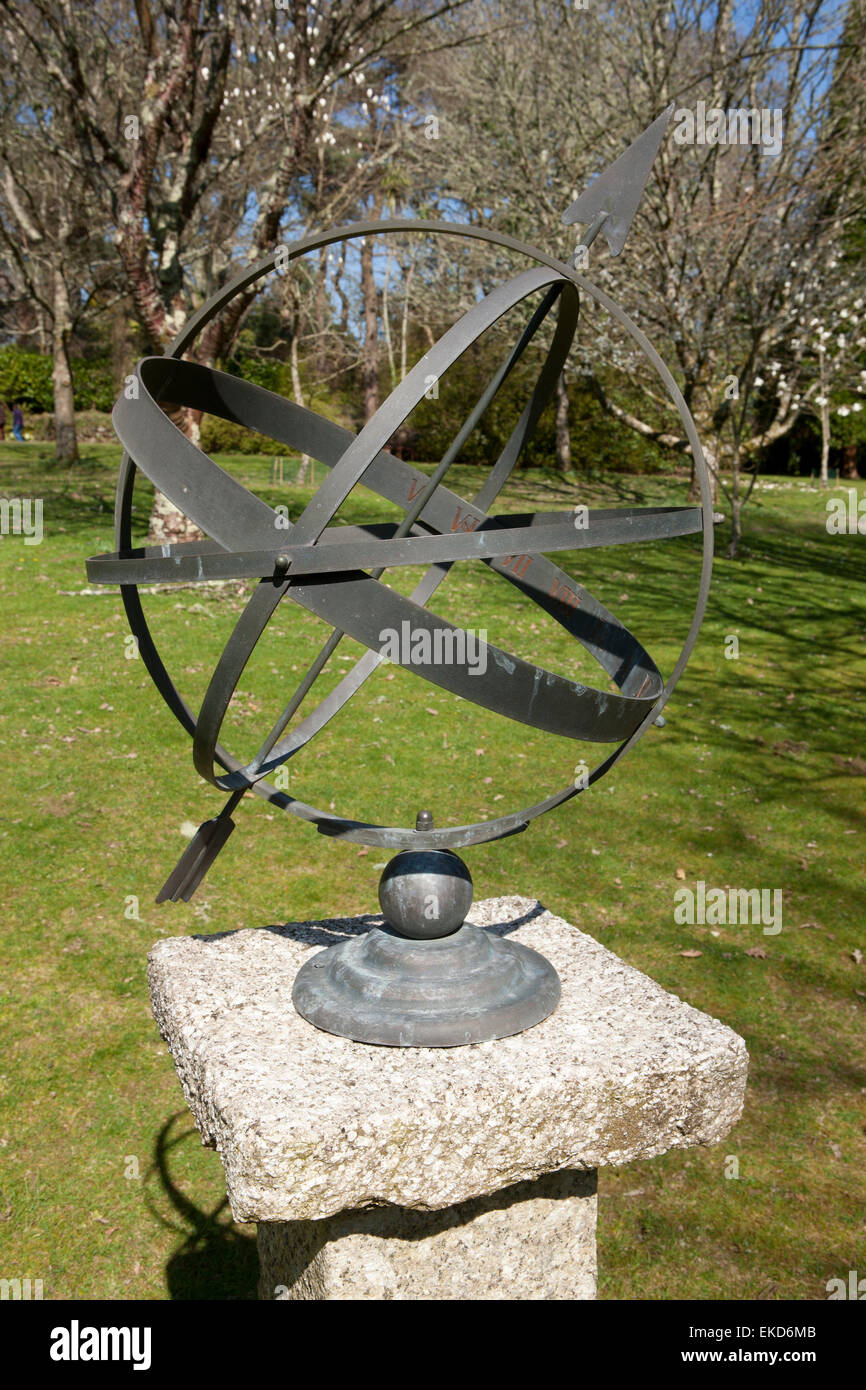 A sundial in the gardens of   Pinetum Park in Cornwall on a spring day. Stock Photo