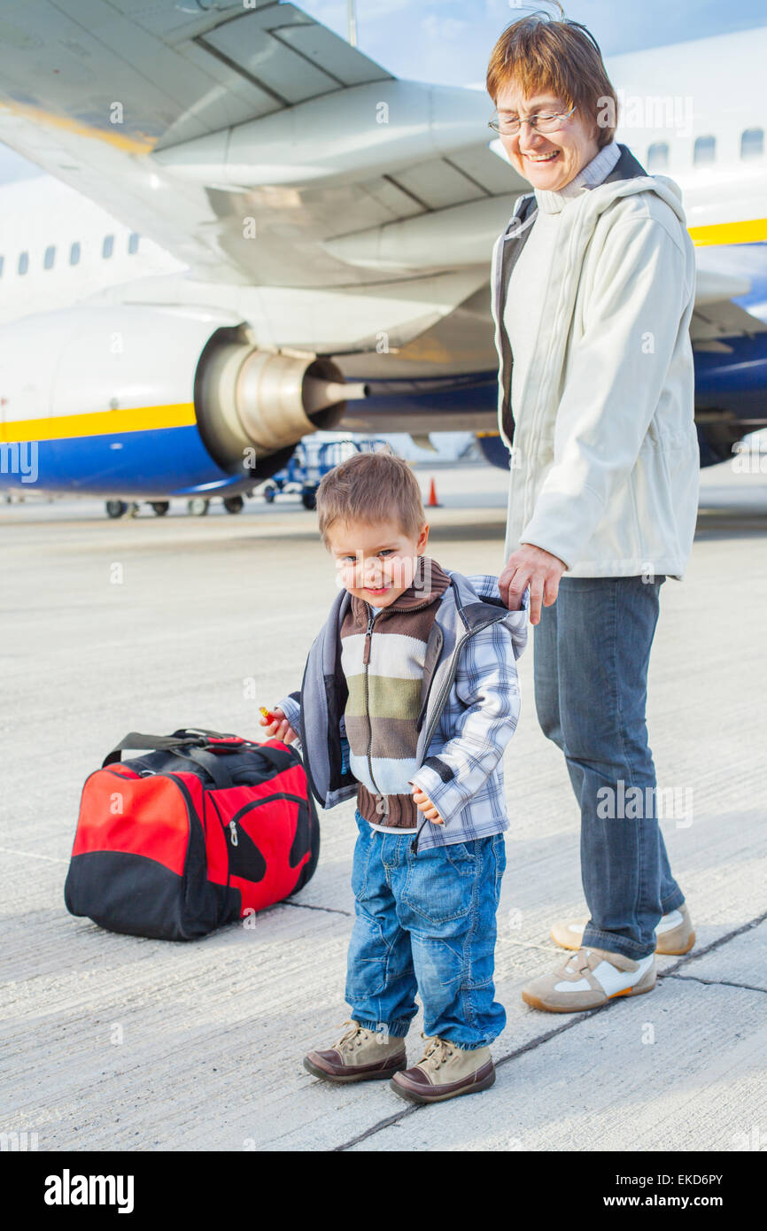 cute boy and his grandmother prepared to fly Stock Photo