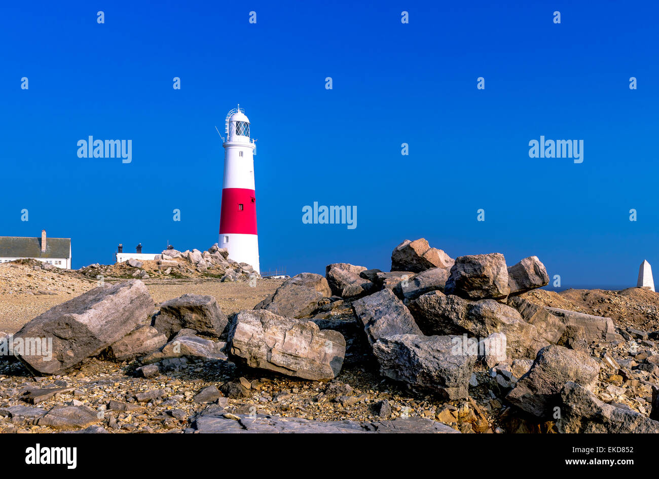 A view of Portland Lighthouse with rocks in foreground. Stock Photo