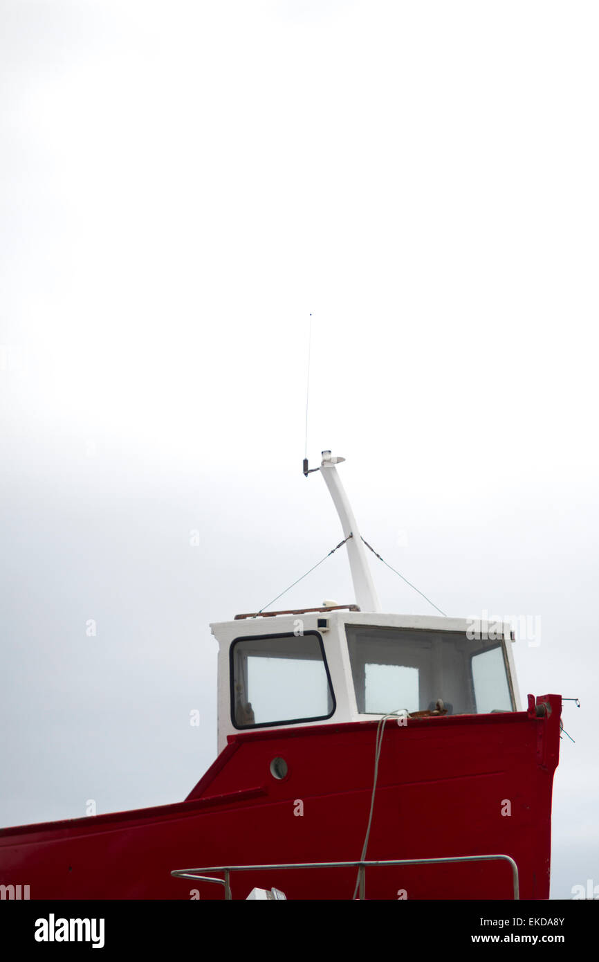 A red boat on the Isles of Scilly Stock Photo