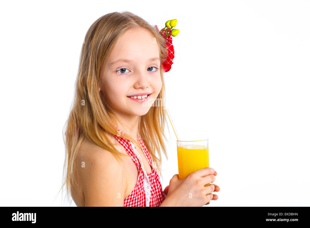 Portrait of little girl drinking orange juice Stock Photo - Alamy