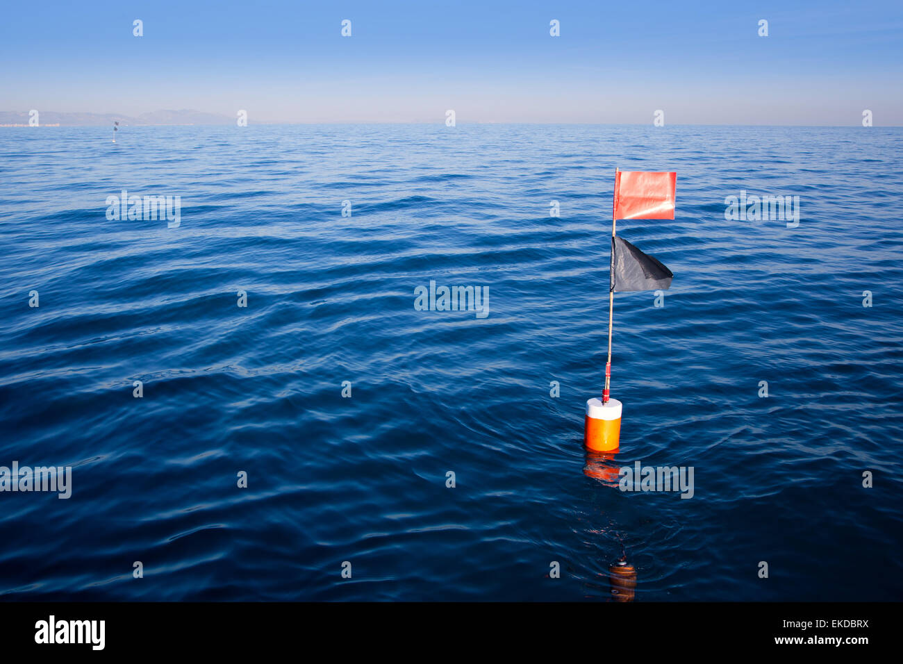 Longliner and trammel net buoy with flag pole Stock Photo